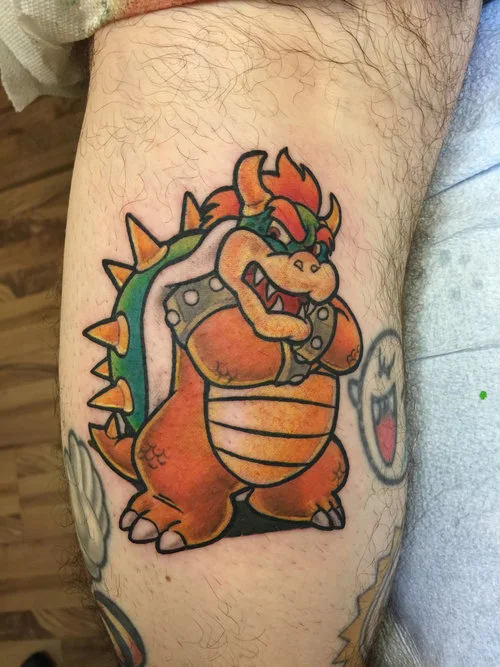 Bowser in color Super Mario tattoo theme leg sleeve.
