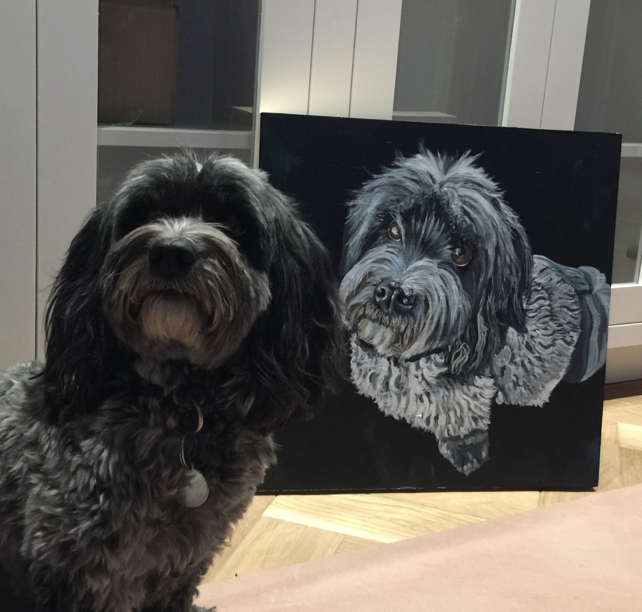 Manny HERE IS MANNY WITH PORTRAIT - I THINK HE LOOKS VERY PROUD!