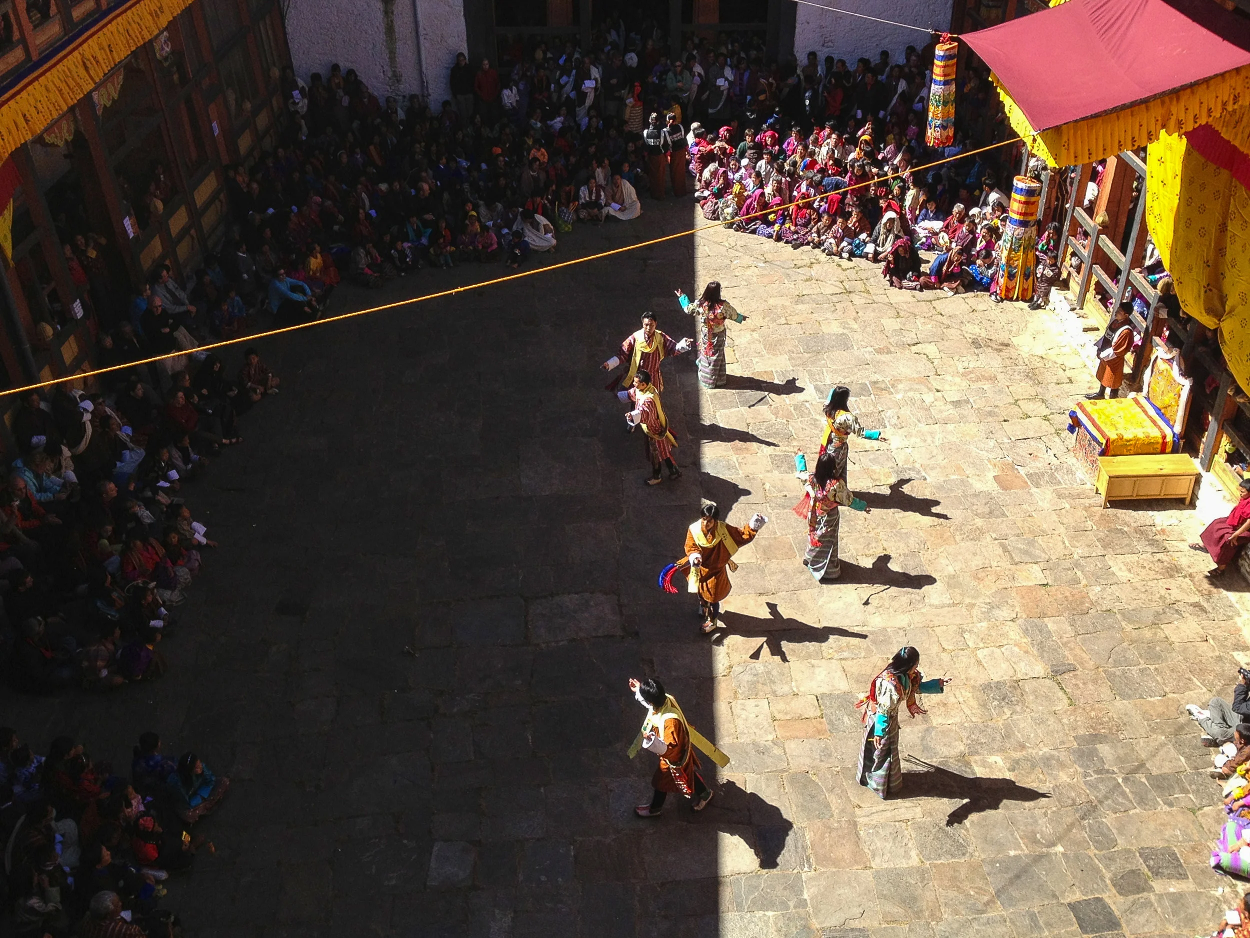 A dance at the annual tshechu in Jakar, Bumthang. Jakar comes from the word bjakhab, or "white bird", in reference to the dzong's foundation myth, according to which a roosting white bird signaled the proper and auspicious location to found a monastery in 1549. Jakar is the capital of Bumthang, where the history of the Tshechu began when Padmasambhava visited Bhutan to aid the dying king Sindhu Raja. He is said to have accomplished this by performing rites, reciting mantras, and performing a dance of subjugation to conquer local spirits and gods in the Bumthang Valley.