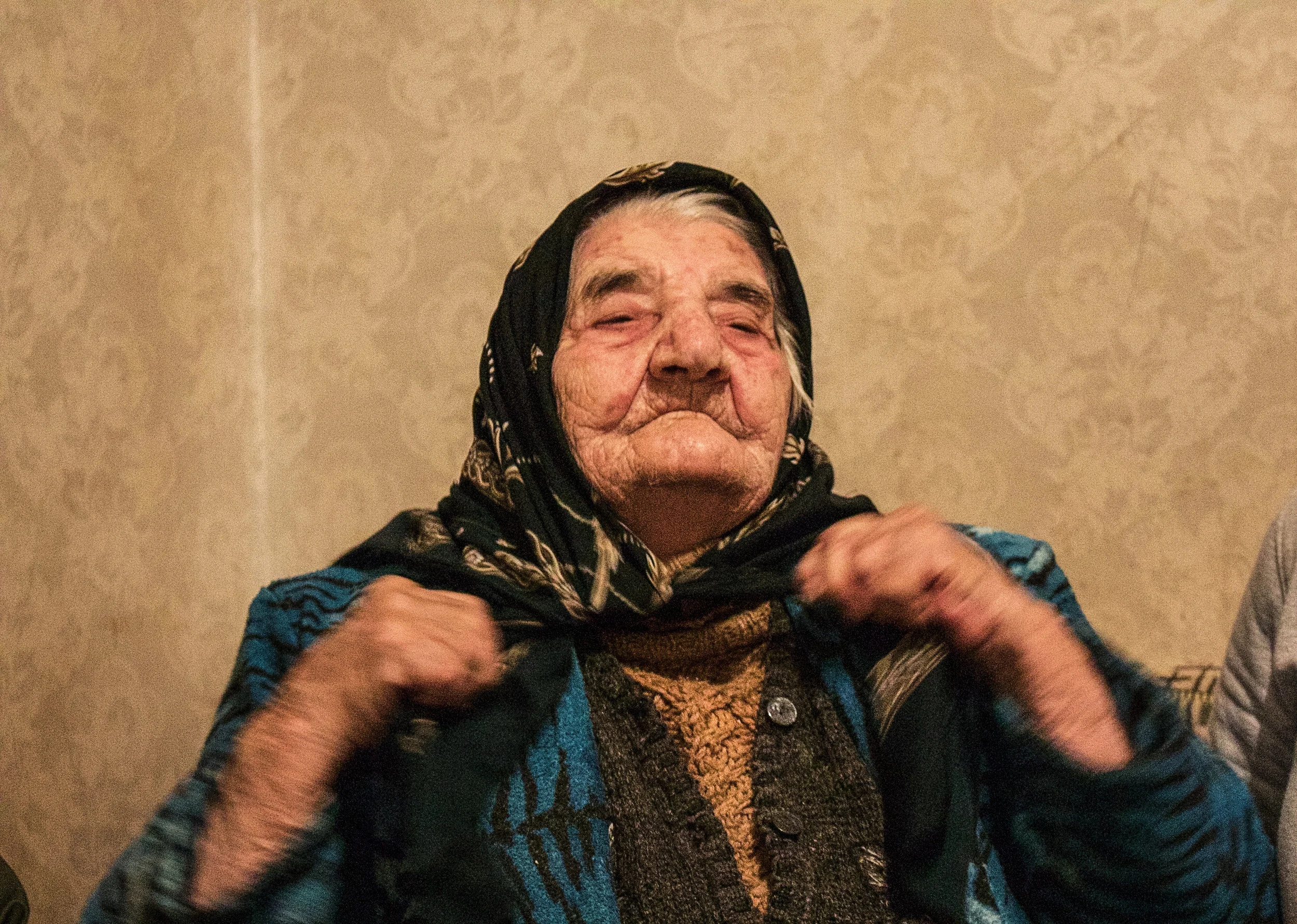 Yepraksia Barseghyan-Gevorgyan, well over 100 years old, tightens her headscarf while she recounts her escape from Laloyi Mavrak in the province of Kars - the village she called home before her father was killed in the genocide of 1915, and the family was forced to flee. She now lives in Armavir, Armenia, and has eight children, 16 grandchildren, 29 great-grandchildren and seven great-great-grandchildren.