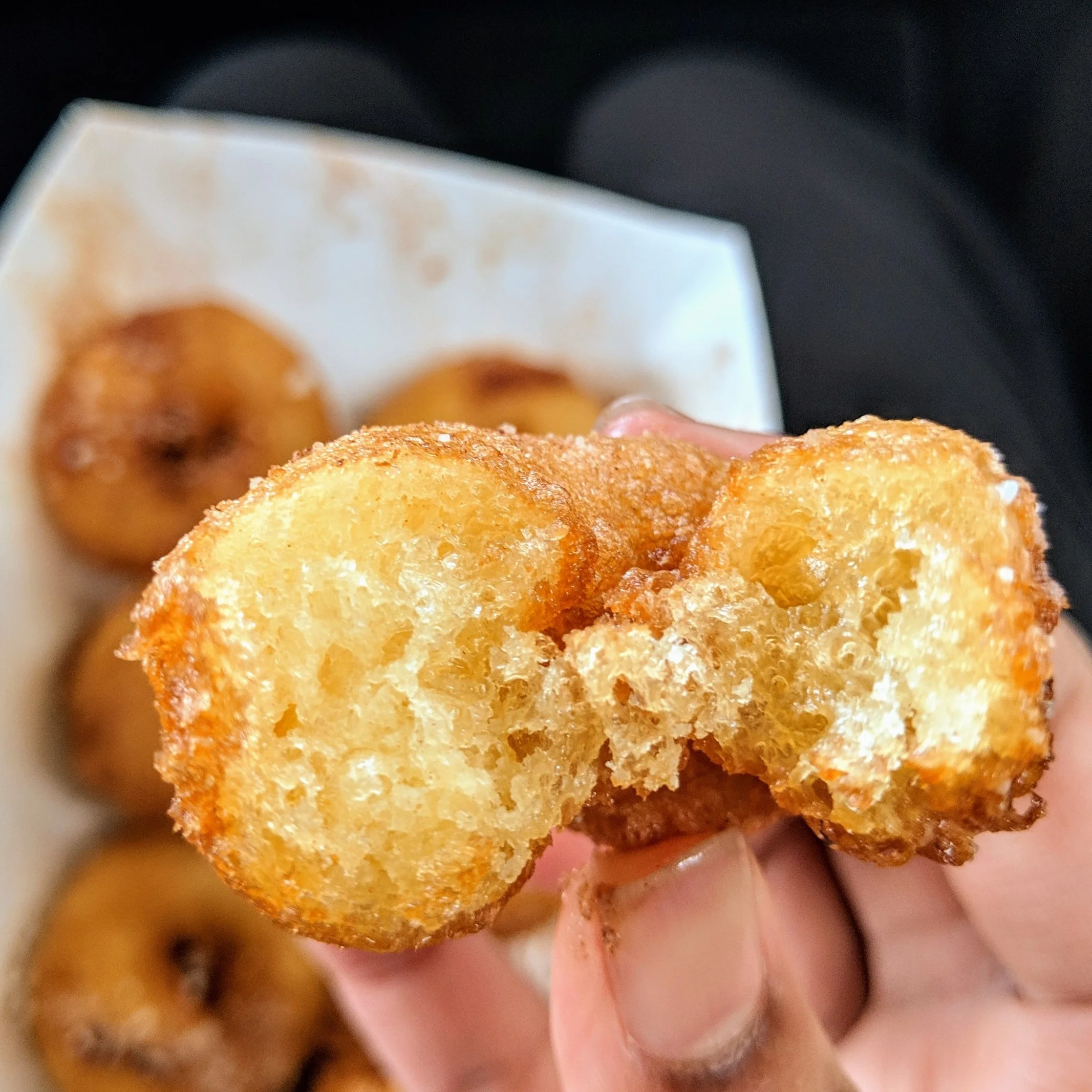 Proceed to the shop named Heavenly Donuts with caution.
