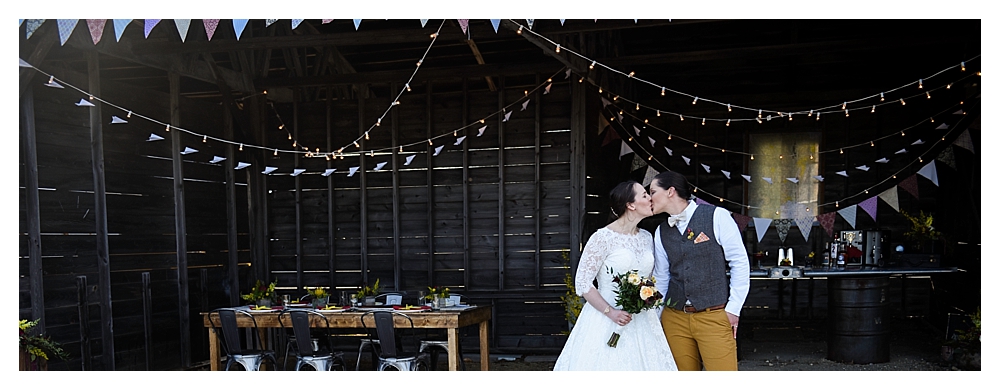 Amelia Earhart Vintage Hangar Wedding Two Brides Kiss.jpg