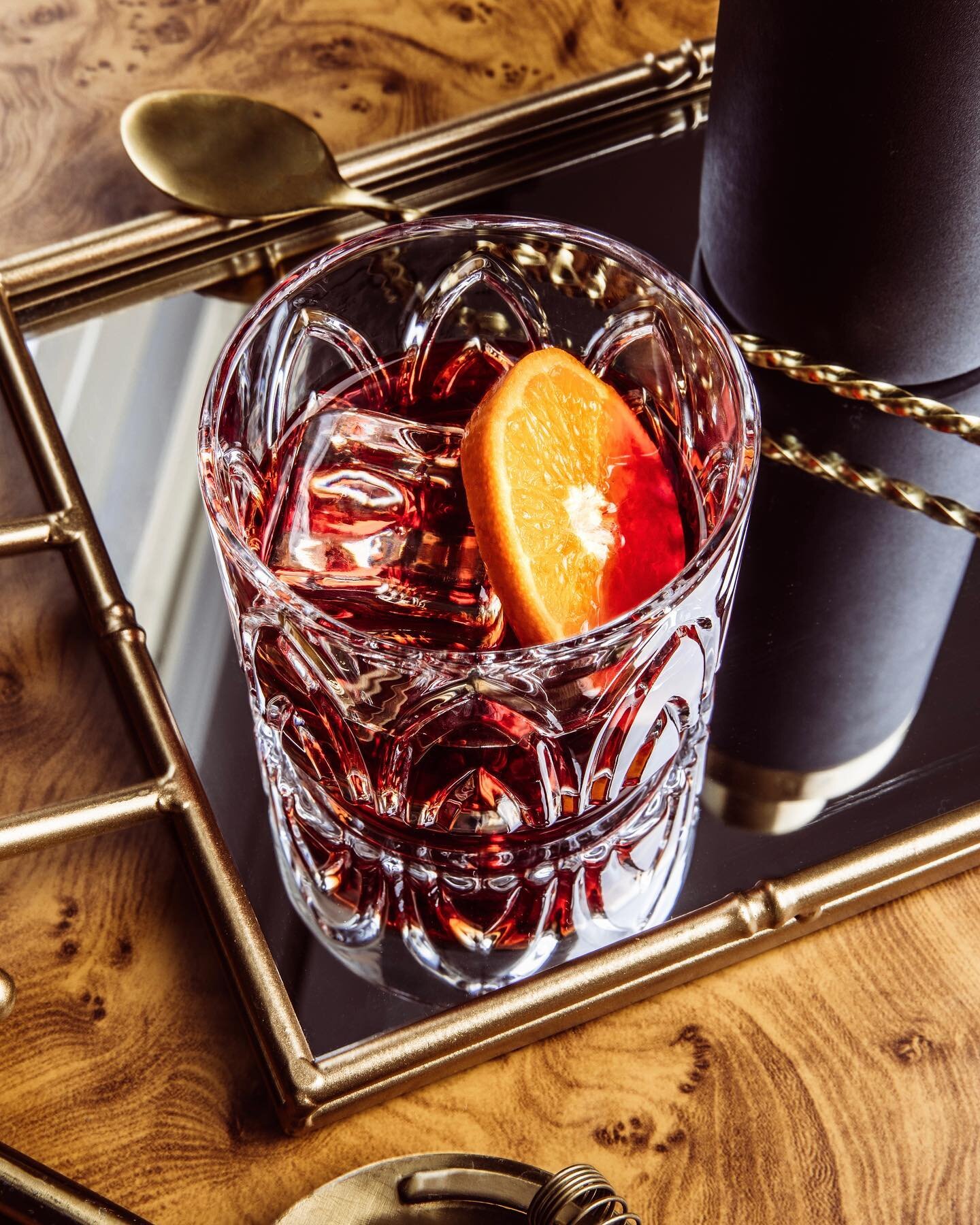 negroni? 

stir equal parts gin, sweet vermouth  and campari with ice until well-chilled. strain into a rocks glass with a large ice cube. garnish with orange. imbibe responsibly.