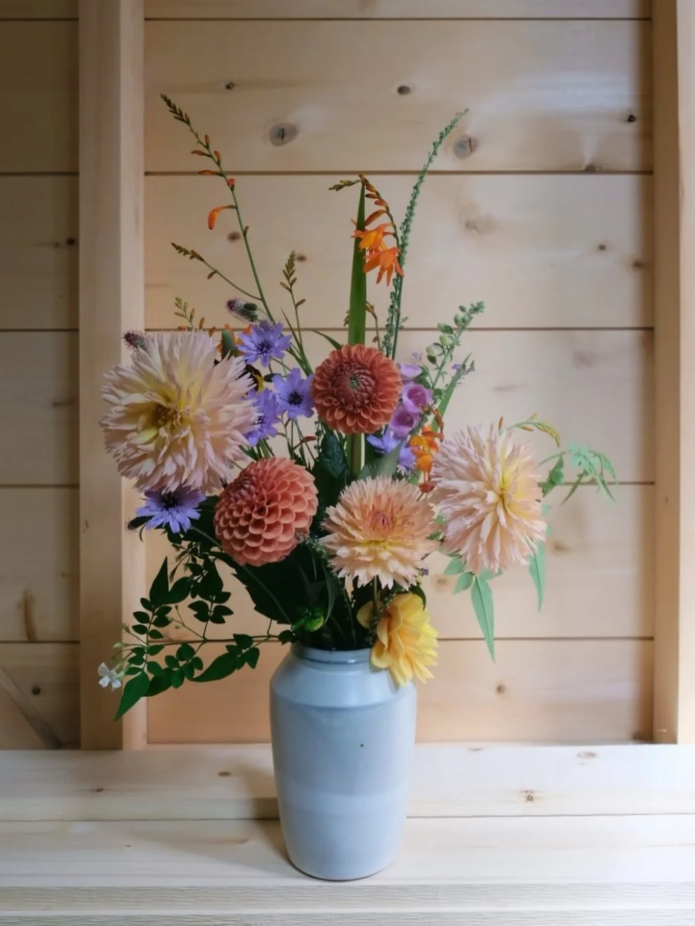 Yard flowers in a soda fired vase. 
The darker lines on the rim are where the soda glaze hit and carbon trapping occurred in the glaze. A little bit of magic you hope for but can never guarantee. 

Available late summer, more details to come💛