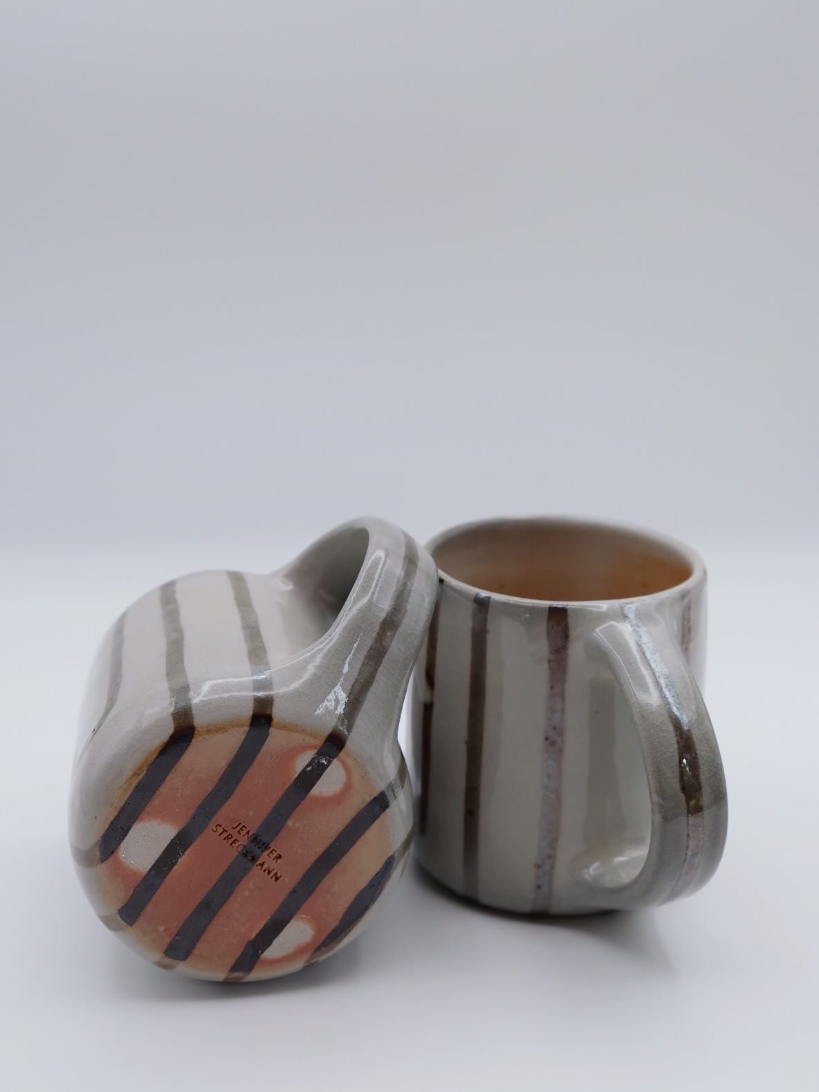 The difference between soda and wood firings. 🔥Smokey greys in the soda and glossy goldens in the wood. 
Both Gordon&rsquo;s Shino on Laguna Cone10 B-Mix clay, with dark brown mason stain inlay.
