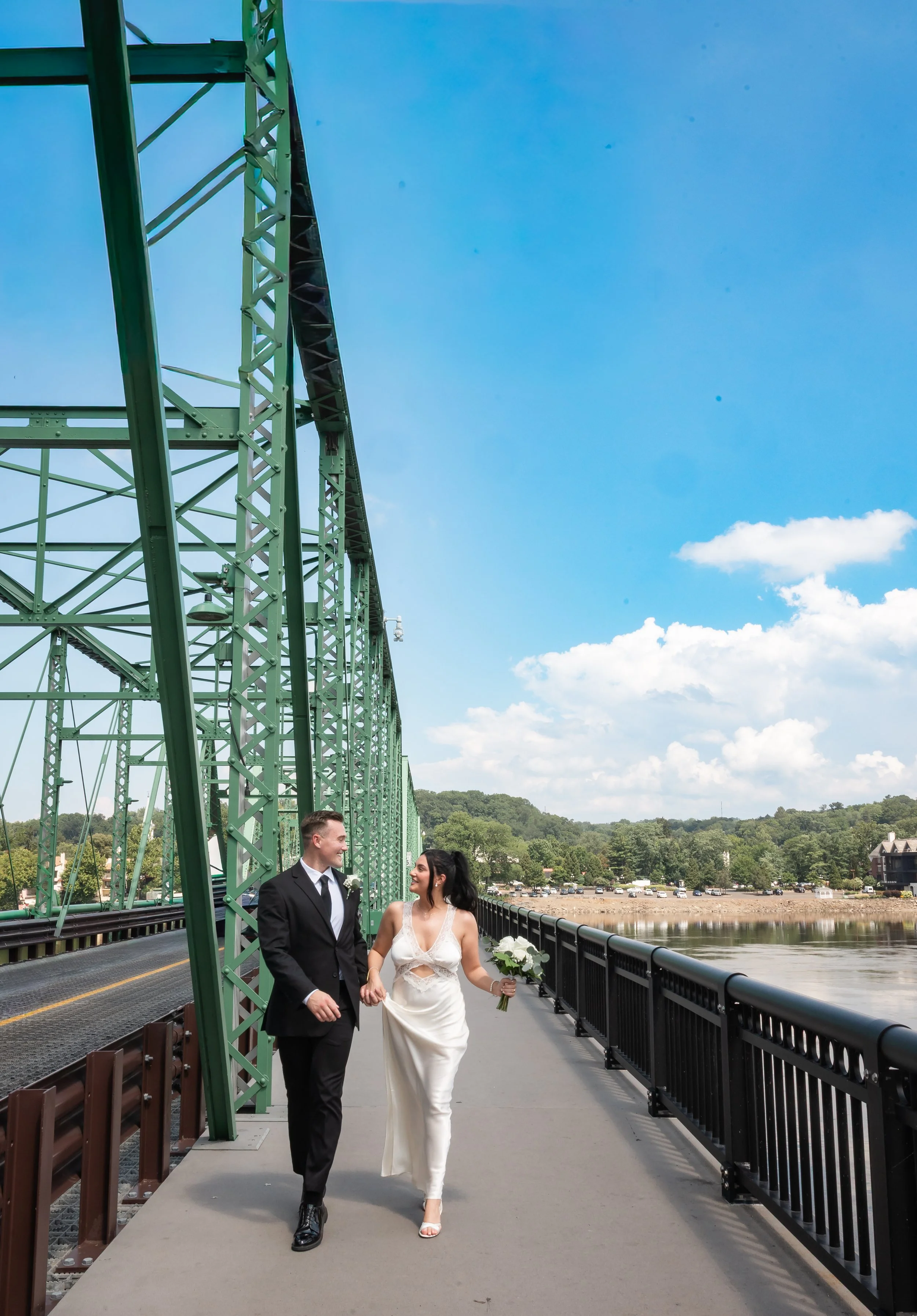 Casey and Dan laughing together during their daytime elopement in New Hope PA