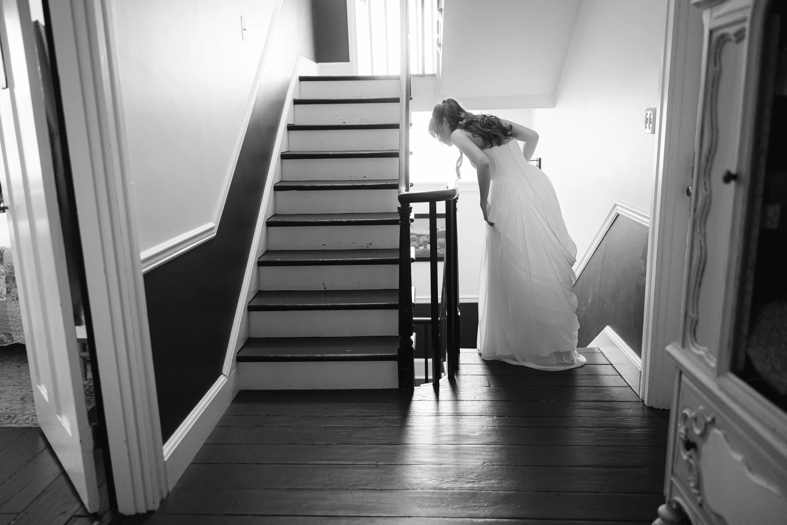 Bride getting ready in candid shot at Bucks County historic mansion wedding