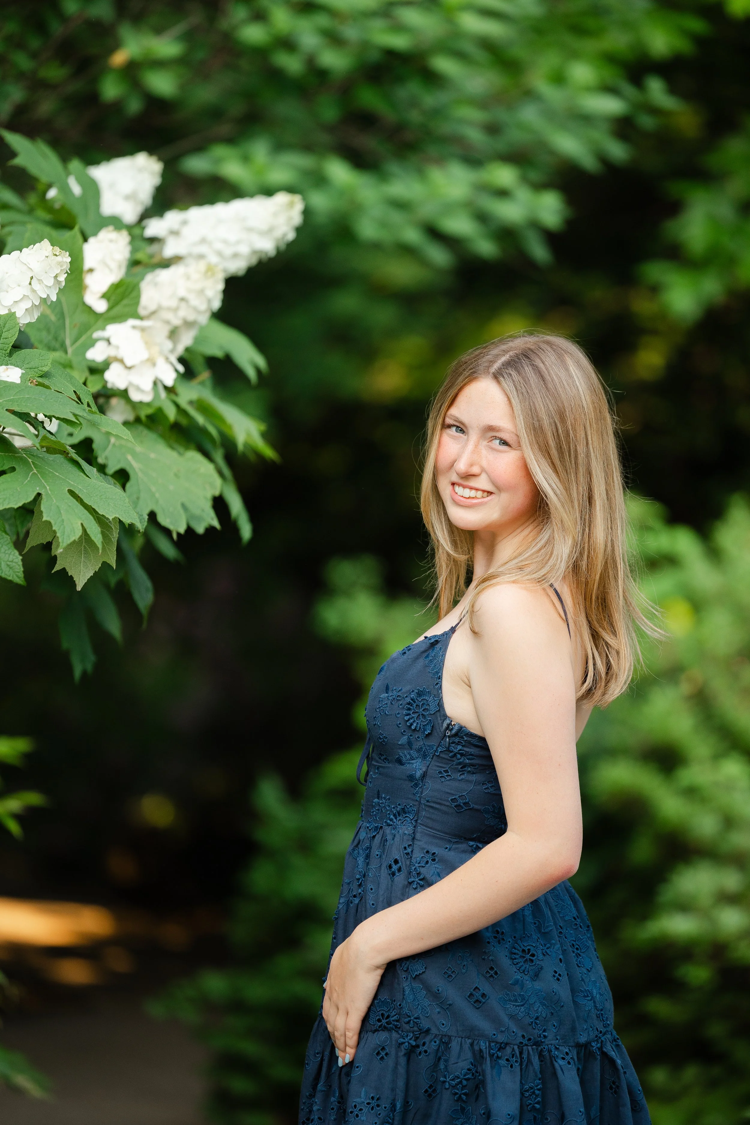 A student posing in a formal portrait for her senior photographs in Bucks County PA