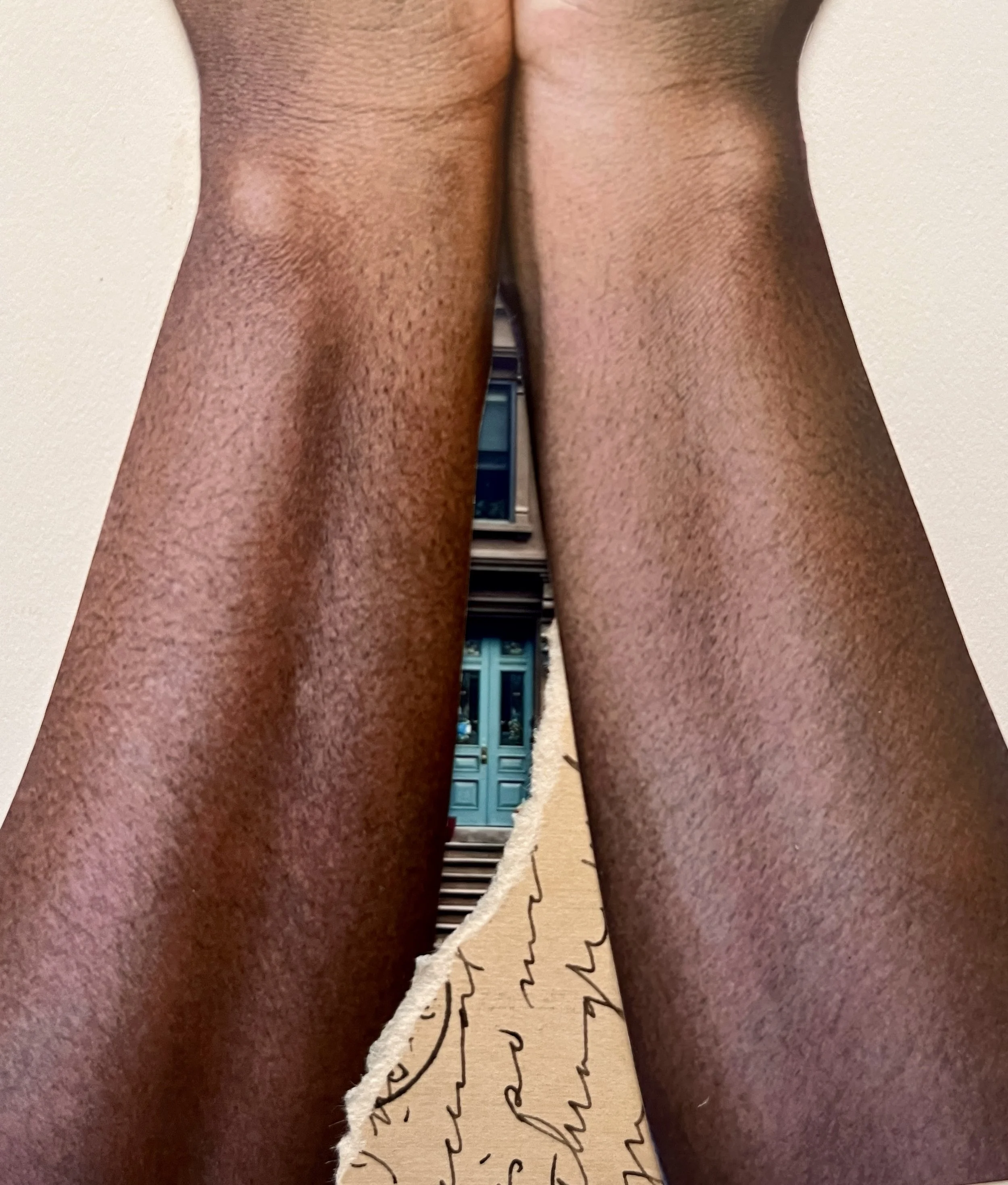 Solid Ground upclose arms with postcard.jpg