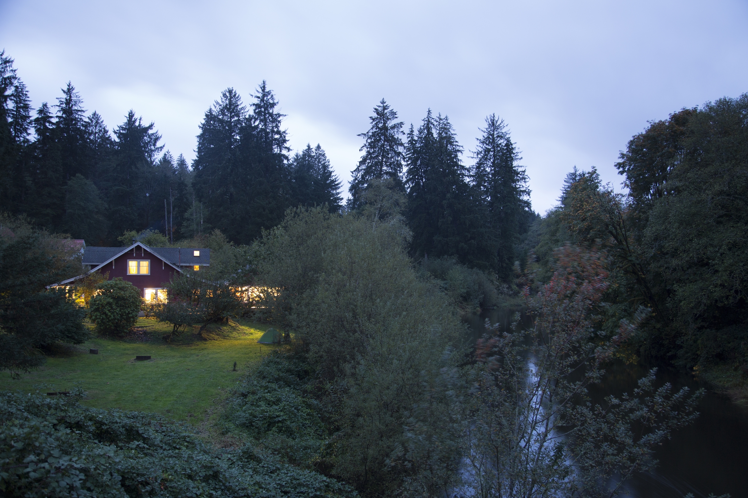 t was dark and rainy as we pulled up to the North Fork home, we were instantly greeted by the most serene, inviting site of the red house gleaming amongst the trees.