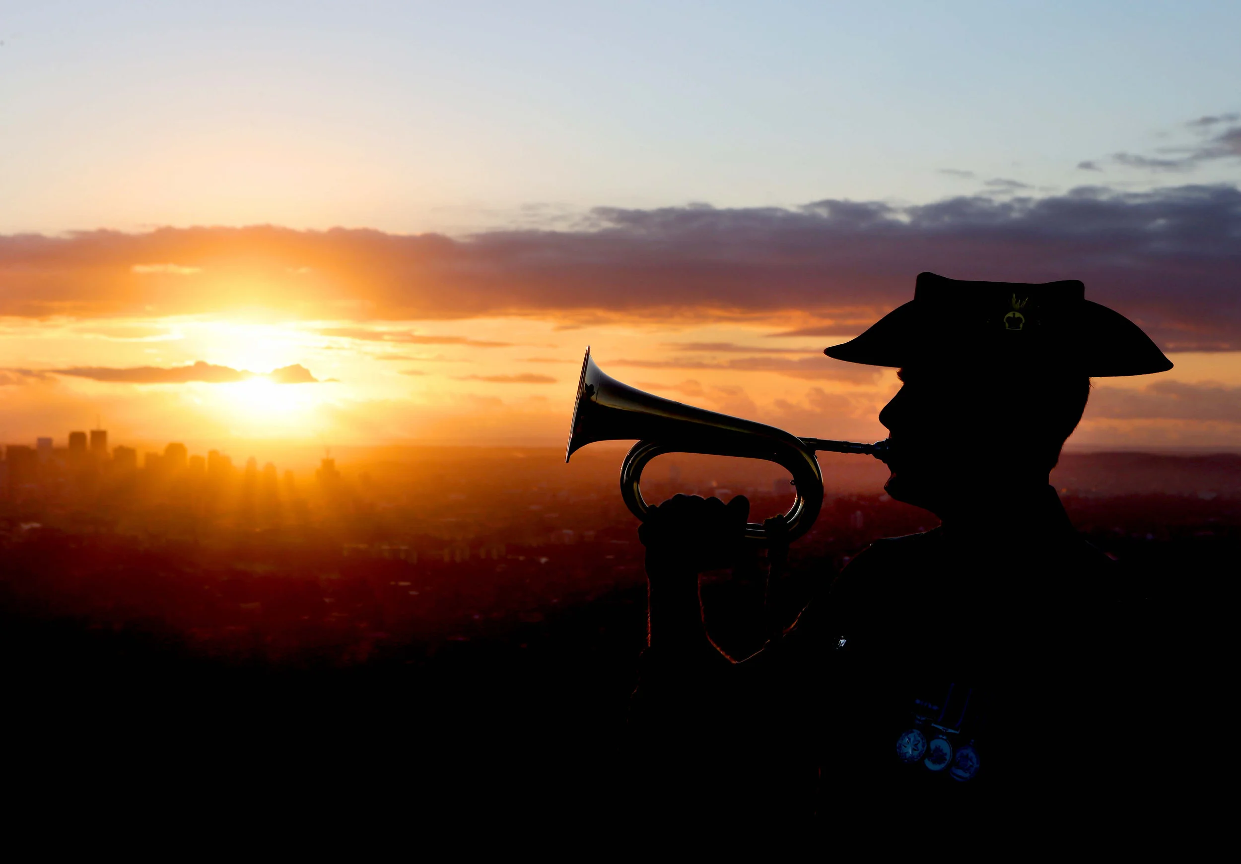 CHP_Export_112952366_QST ONLY ANZAC DAY SPECIAL Dawn shot of soldier LCPL Brent Power at Mt Coot-th.jpg
