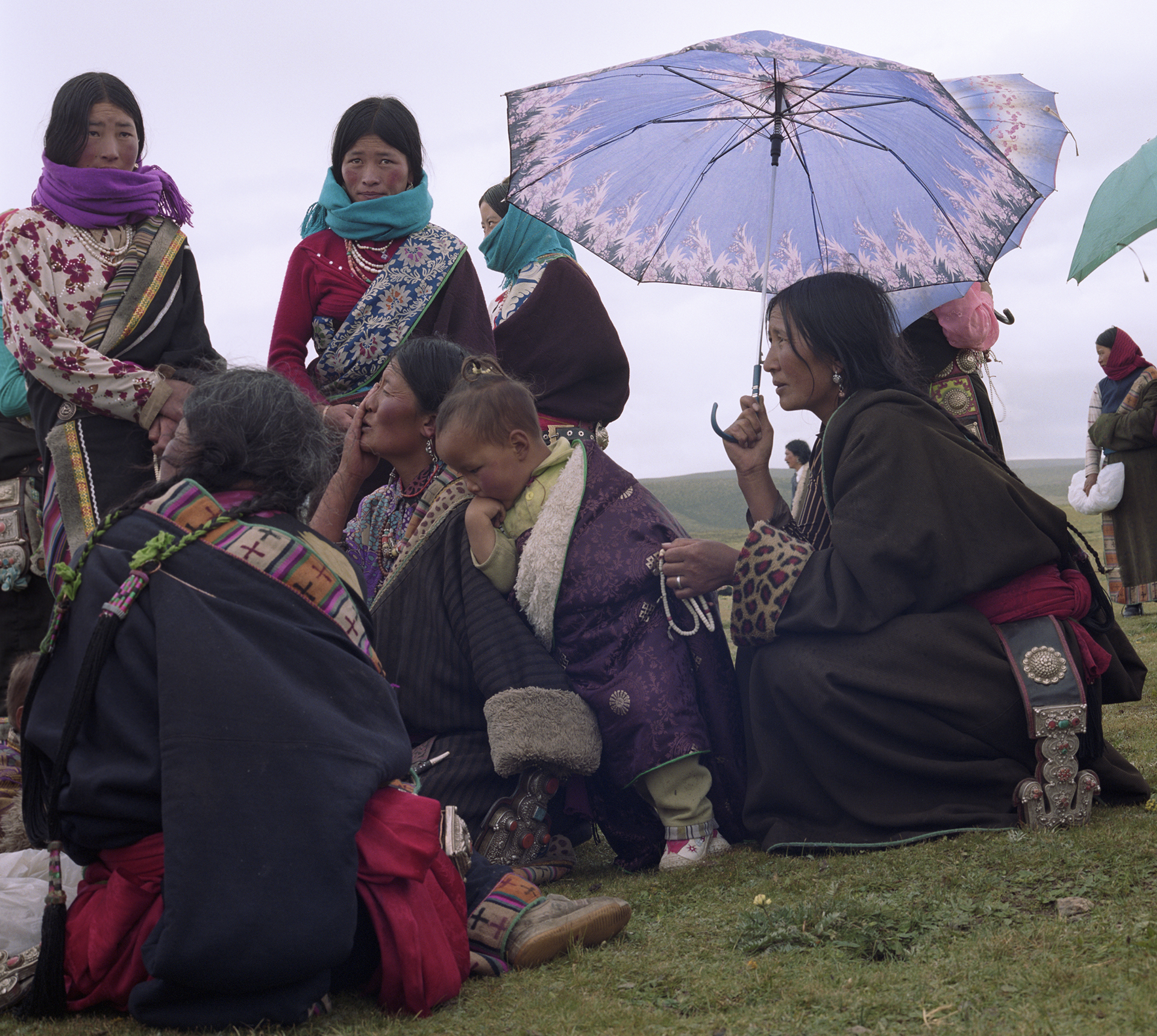 2007 Qinghai - women at the festival, wearing their best clothes and jewelry.