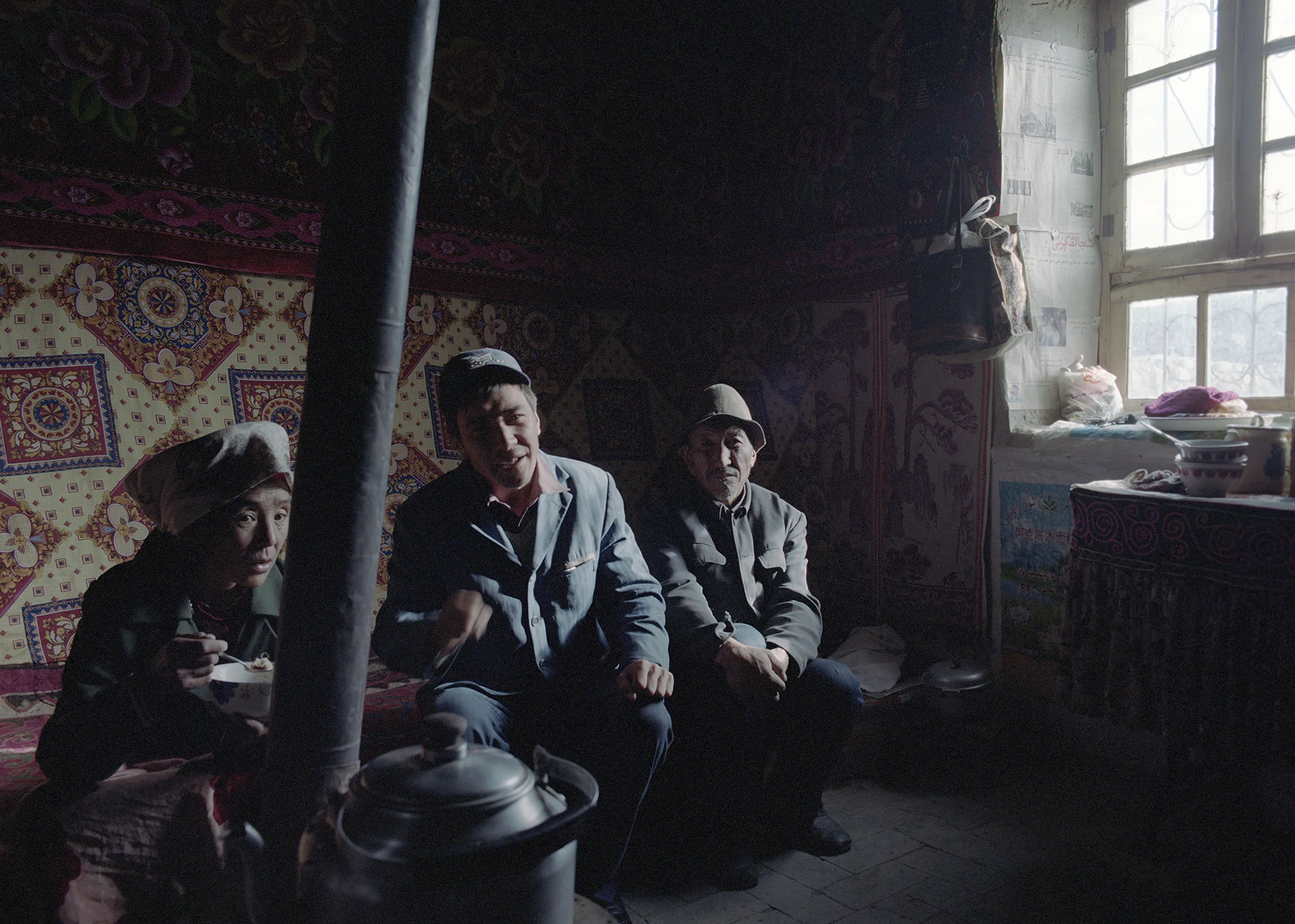 2007 Xinjiang -village family at breakfast.