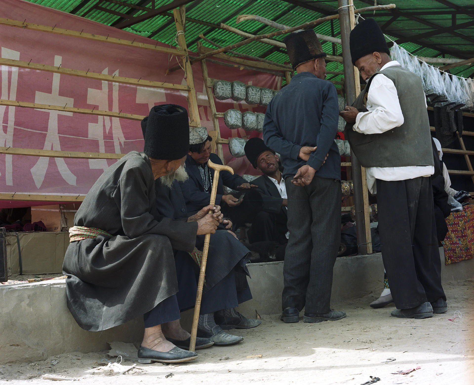 2007 Xinjiang - mens' corner at a local market on the Silk Road.