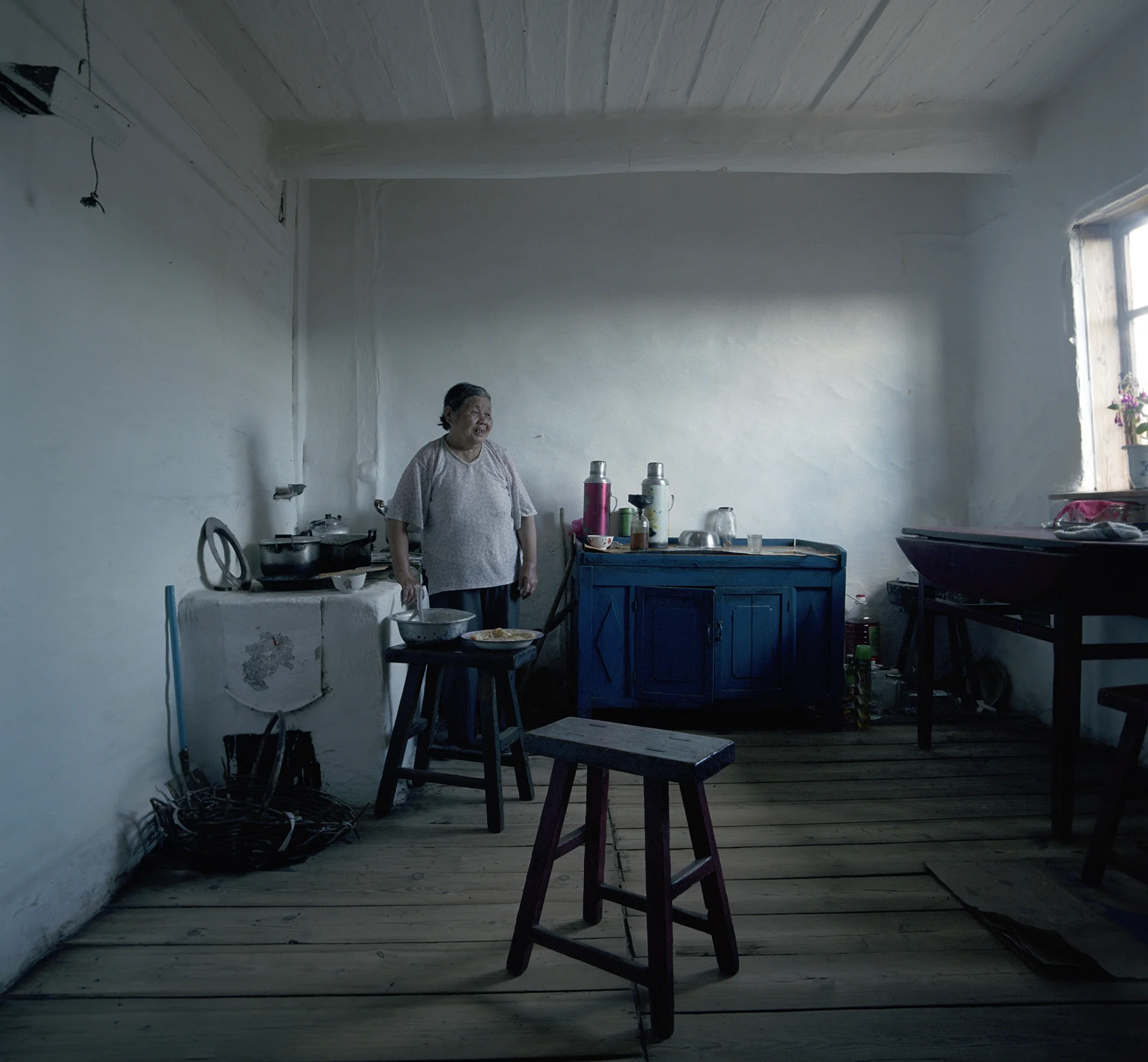 2008 Inner Mongolia - babouschka is baking real Russian blini's.