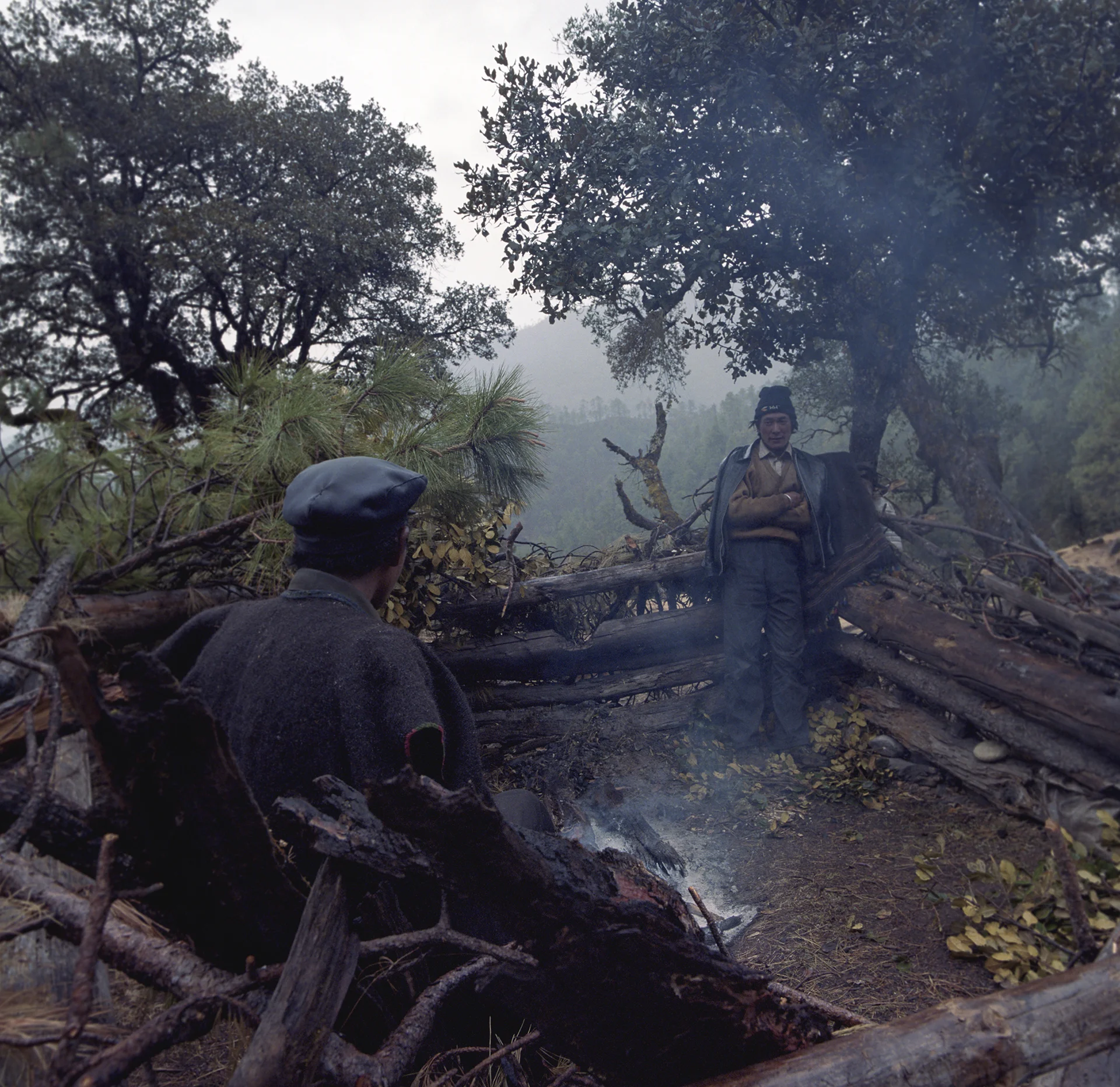 2010, in the vicinity of Lugu Lake - Moso men in the forest.