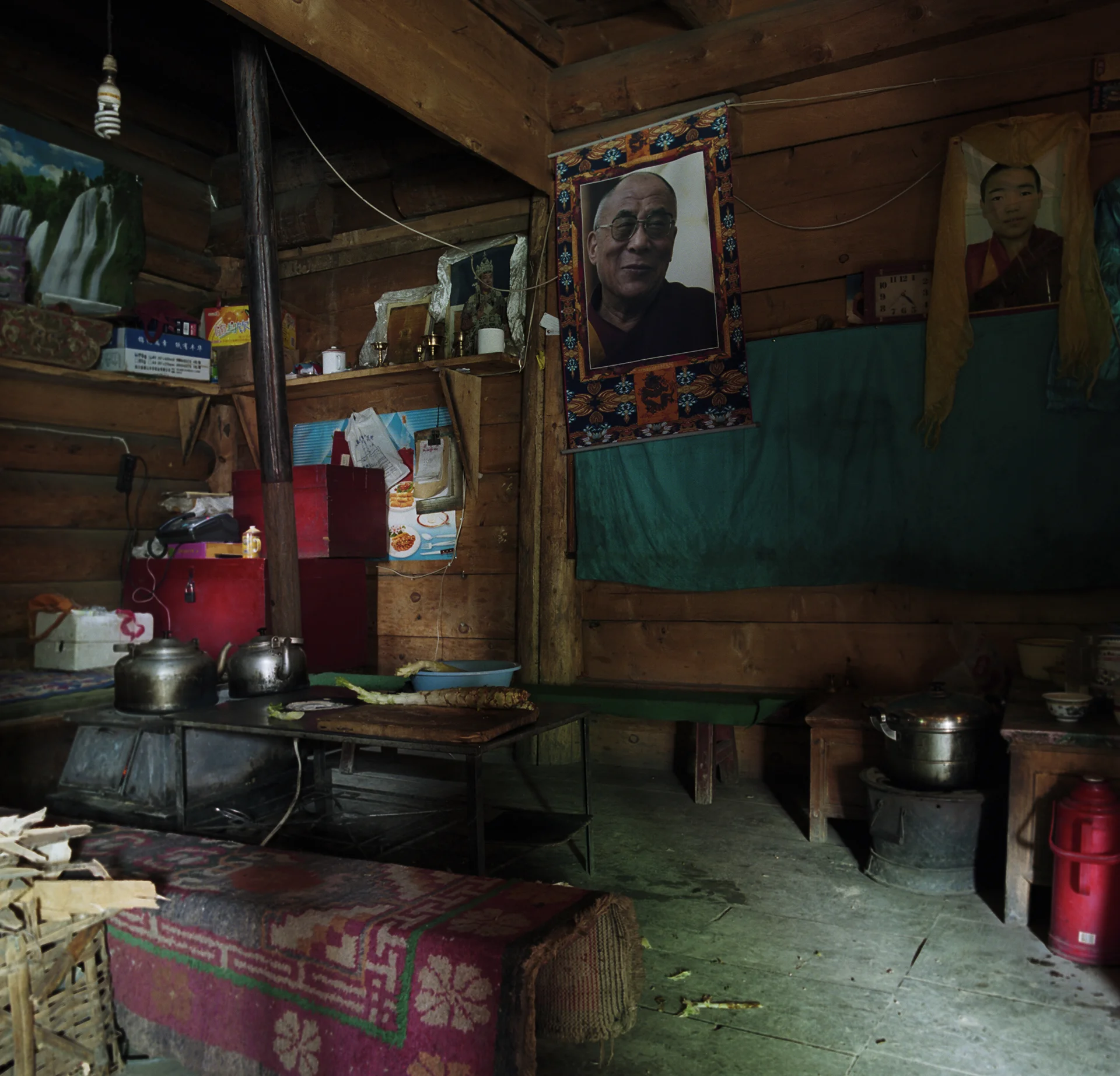 2010, Lijiu - GatTe Leh kitchen. In this area seeing pictures of the Dalai Lama is very normal.
