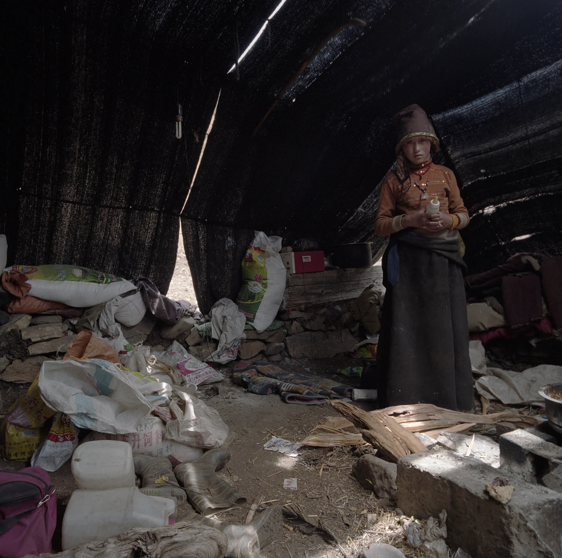 2010, near Litang -this is the "romantics" of Nomad life. There were 4 more kids and a baby living in this tent.