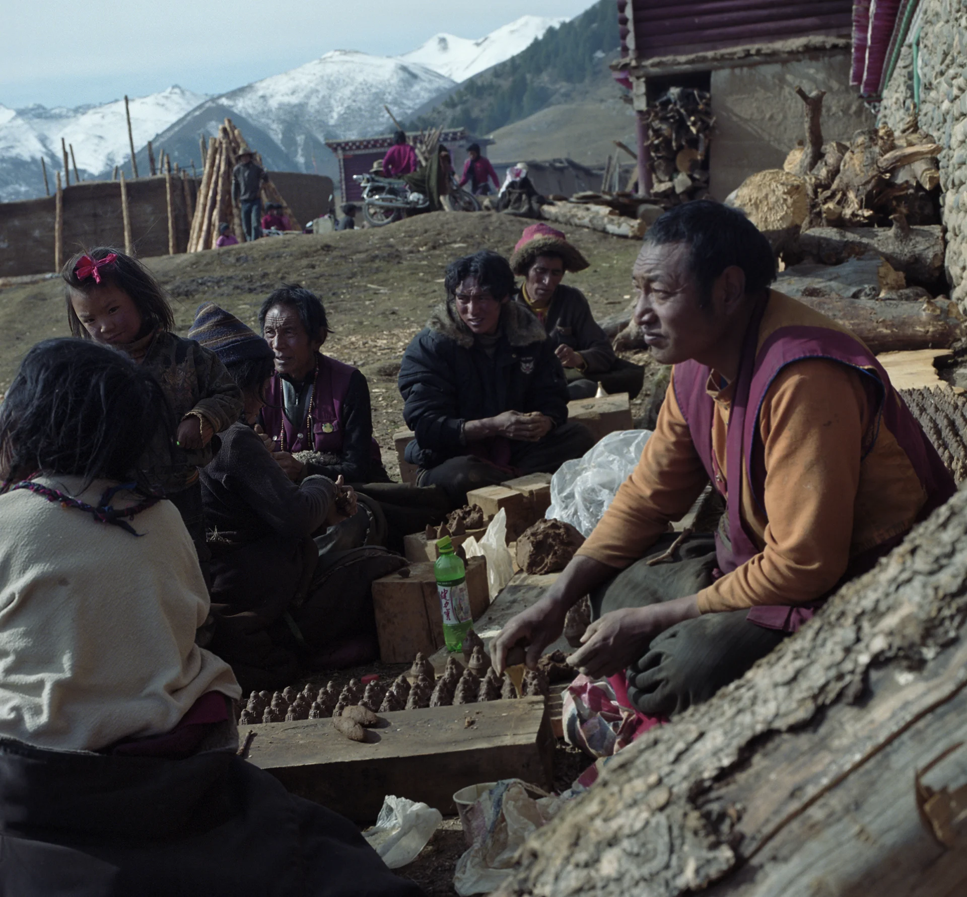 2010, near Litang - festival in the village. They are making ritual clay figurines. The more you make the beter.