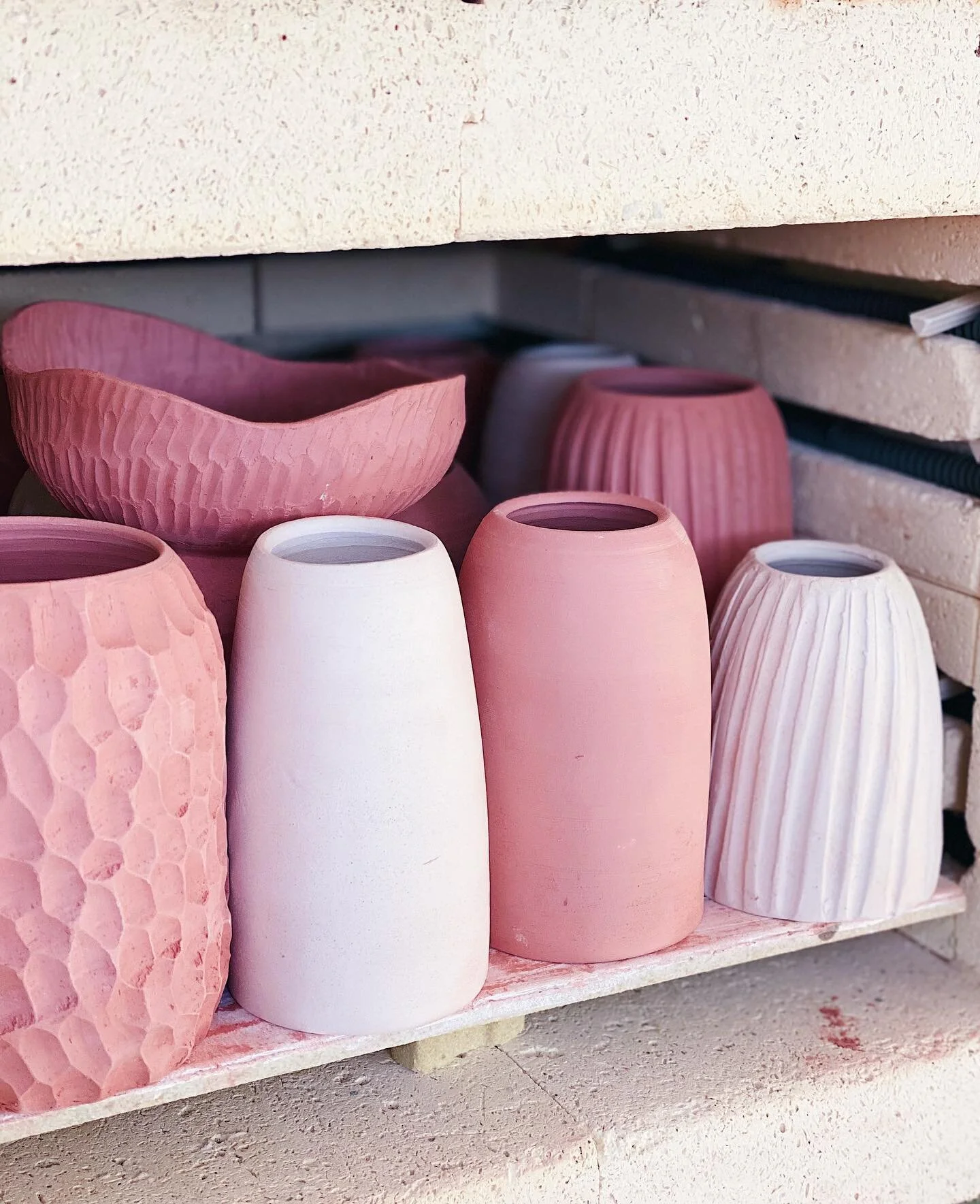 Warm bodies... I just love the pink of this clay after bisque firing. Won&rsquo;t stay that way too long though....
.
.
.
.
.
.
.
#kilnopening #wheelthrownpottery #carvedclay #budvase #australianceramics #gippsland #handmadepottery #smallbatchceramics #kilngods
