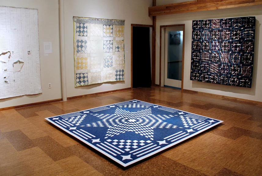 Installation Shot of Between: Layering Context & Perception in Patchwork. Artists pictured clockwise from the top left: Rachel Meginnes , Rachel Meginnes , Jess Jones , and Sonja K. Dahl . 