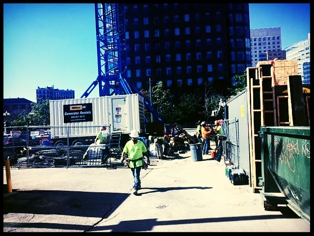 Artist's rendering (above) and the building site today.