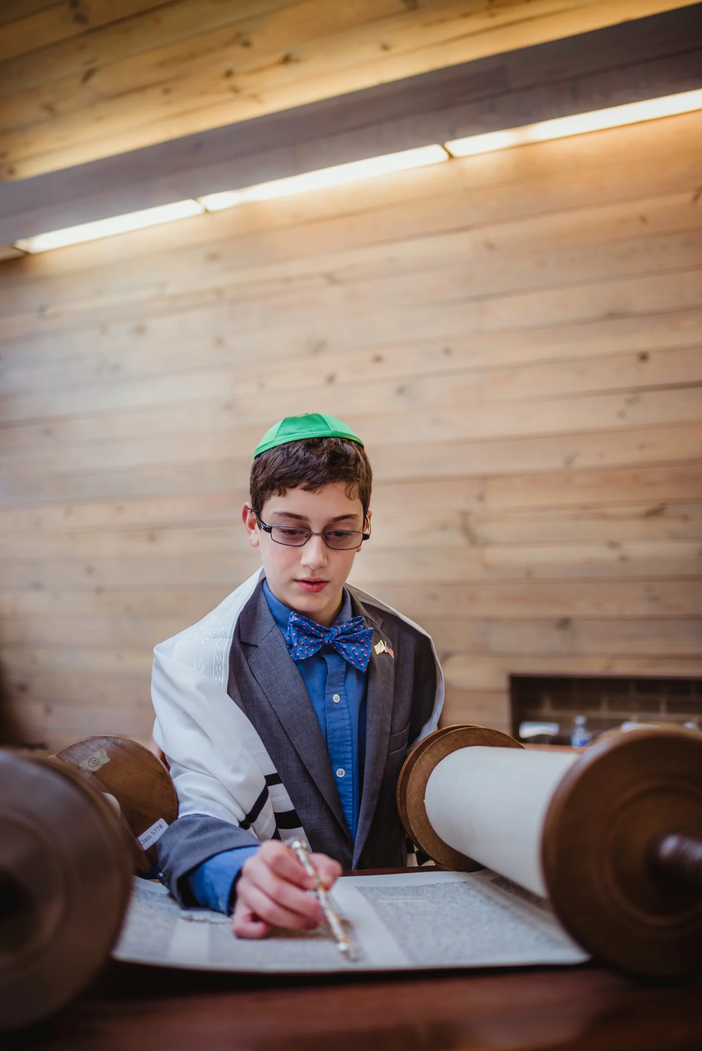 Mitzvah-boy-reading-from-the-torah-on-the-bima-in-Raleigh.jpg