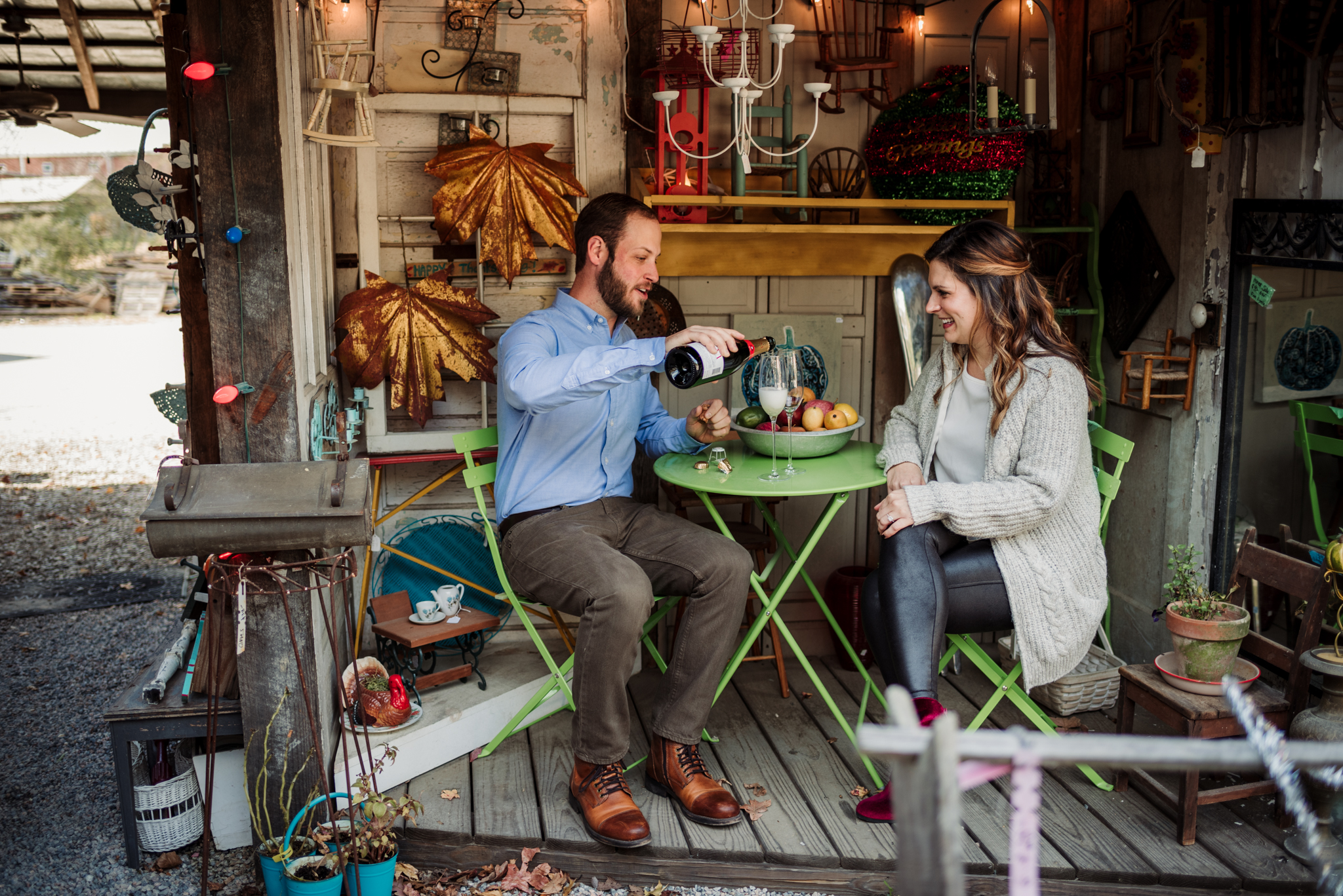Pouring-champagne-to-toast-their-engagement-in-Raleigh.jpg