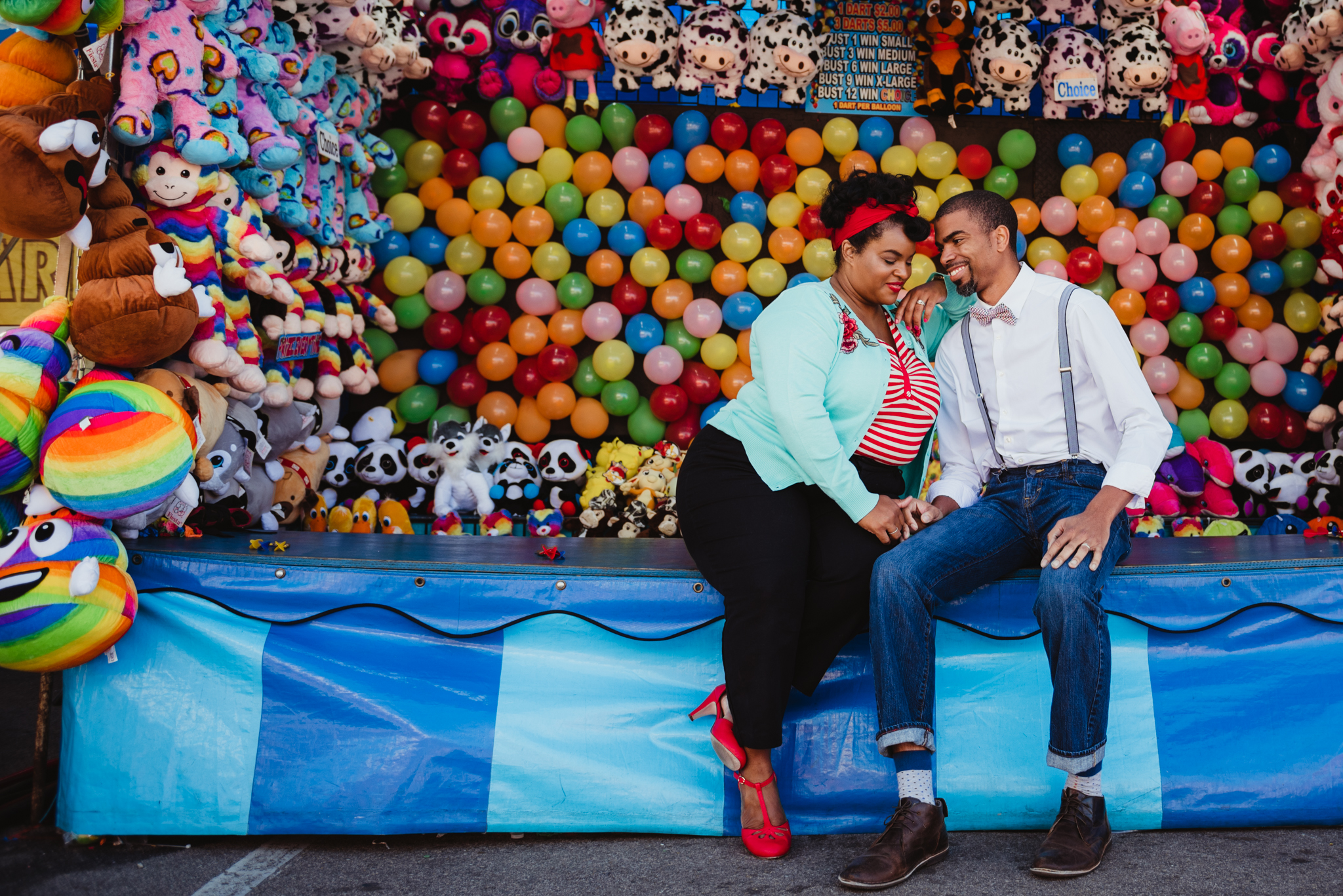 snuggling-together-in-front-of-the-balloons-at-the-NC-State-fair.jpg