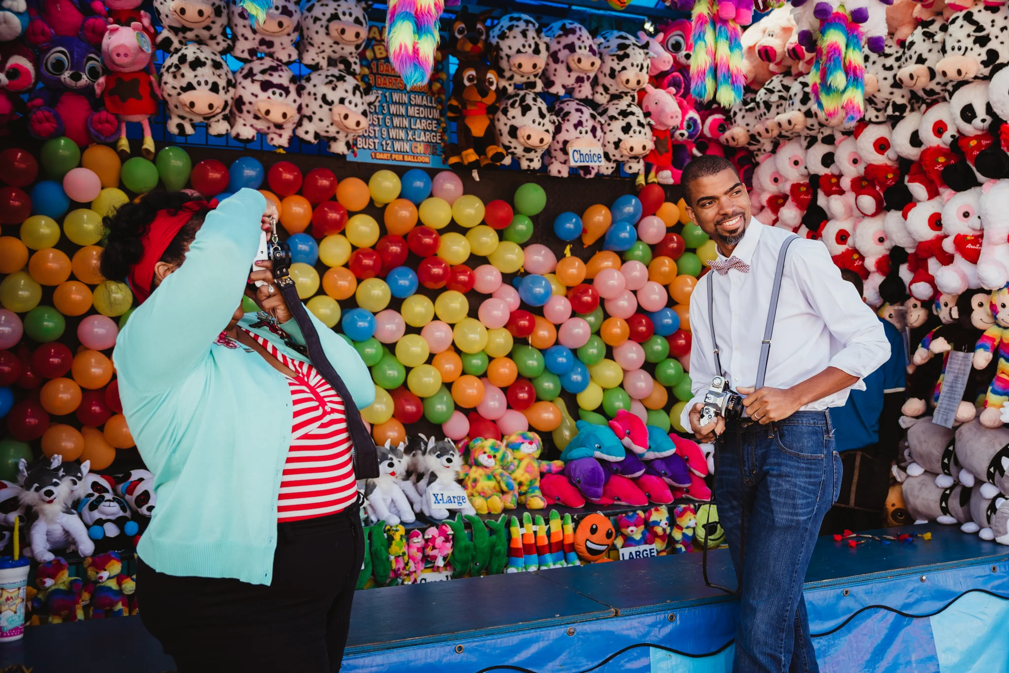 taking-pictures-of-her-groom-with-vintage-cameras-at-the-NC-State-fair.jpg