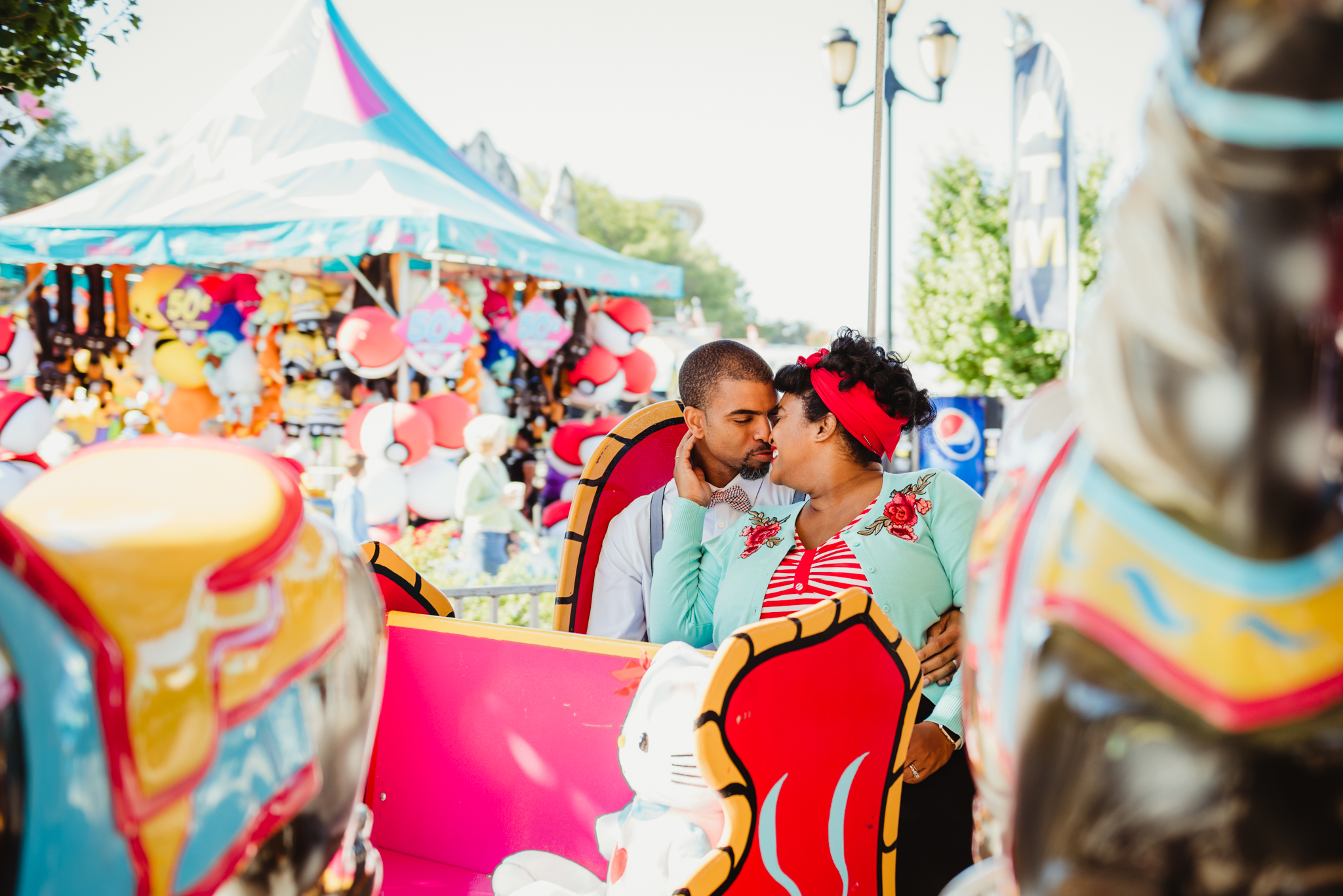 going-in-for-a-kiss-while-riding-the-carousel-at-the-NC-State-fair.jpg