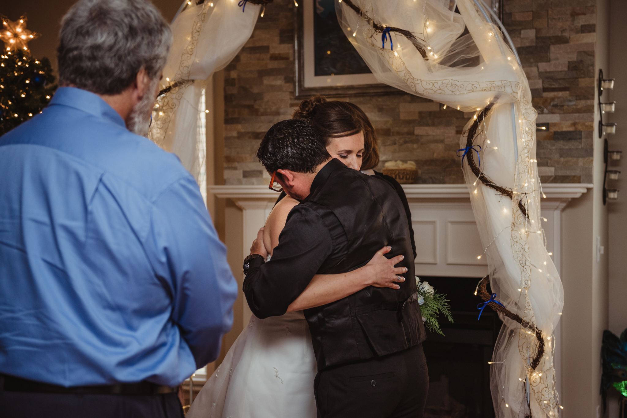the-bride-and-groom-embrace-when-they-first-see-each-other-at-their-intimate-home-wedding-in-Raleigh.jpg