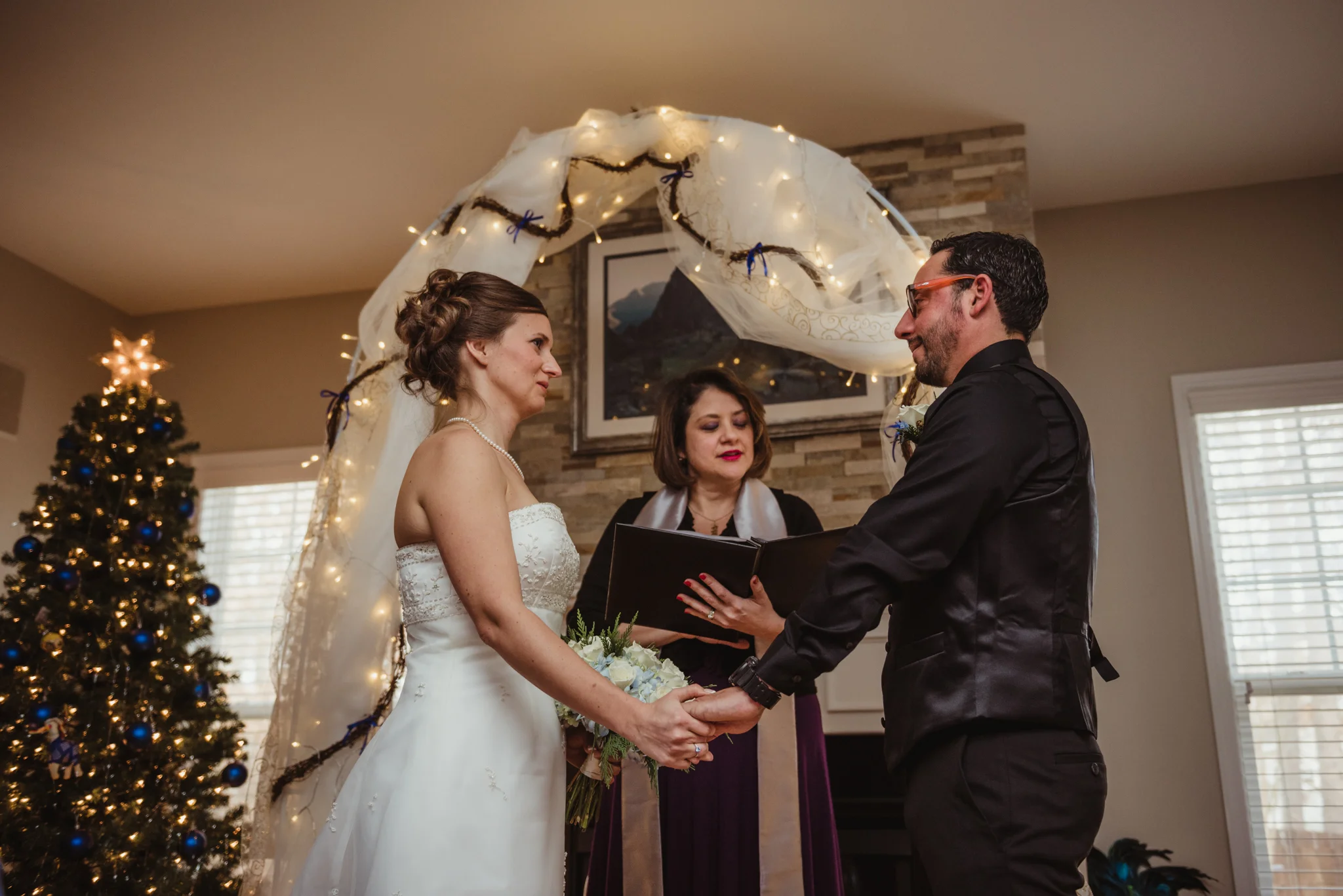 the-bride-and-groom-exchange-vows-at-their-intimate-home-wedding-in-Raleigh.jpg