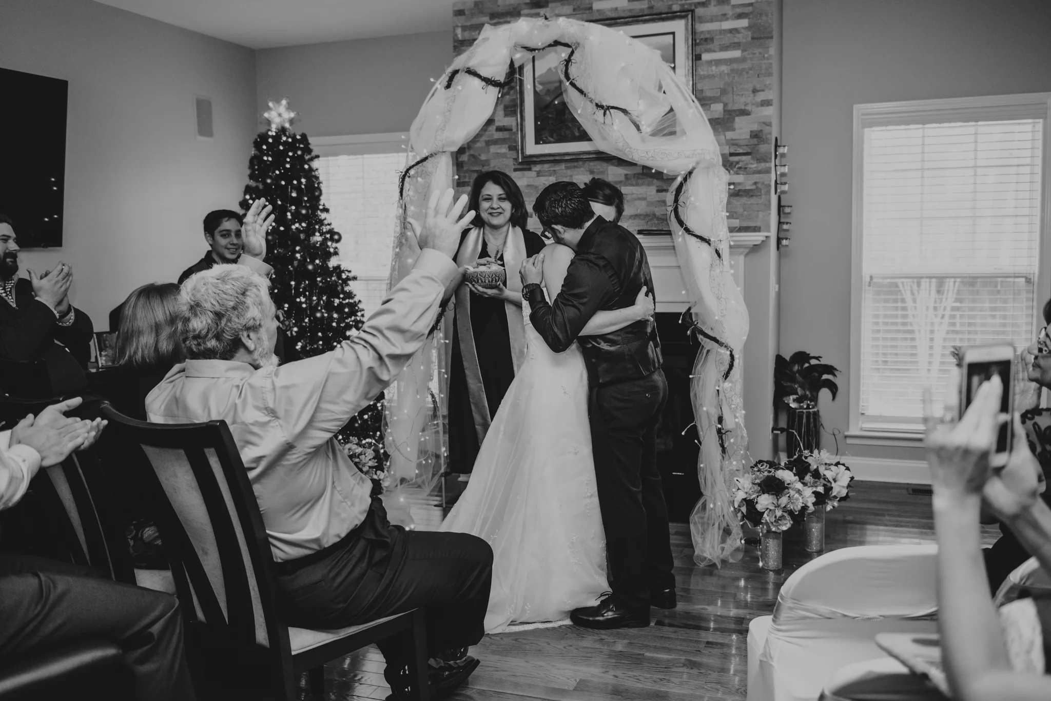 the-bride-and-groom-embrace-after-their-vows-at-their-intimate-home-wedding-in-Raleigh.jpg