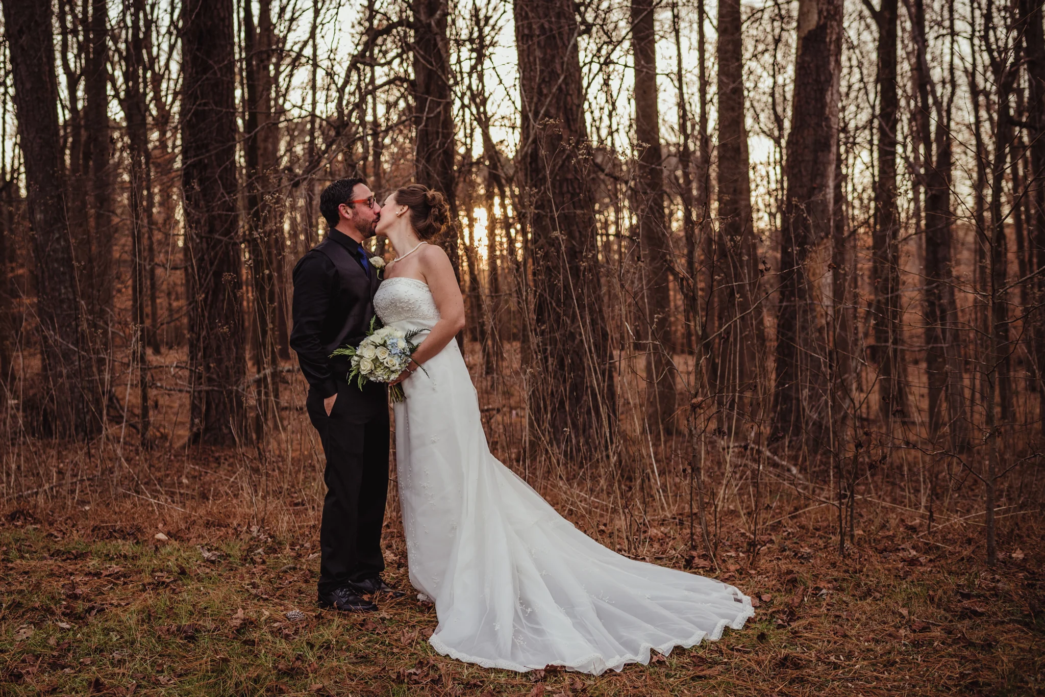 the-bride-and-groom-pose-for-a-kiss-at-a-local-park-here-in-raleigh.jpg