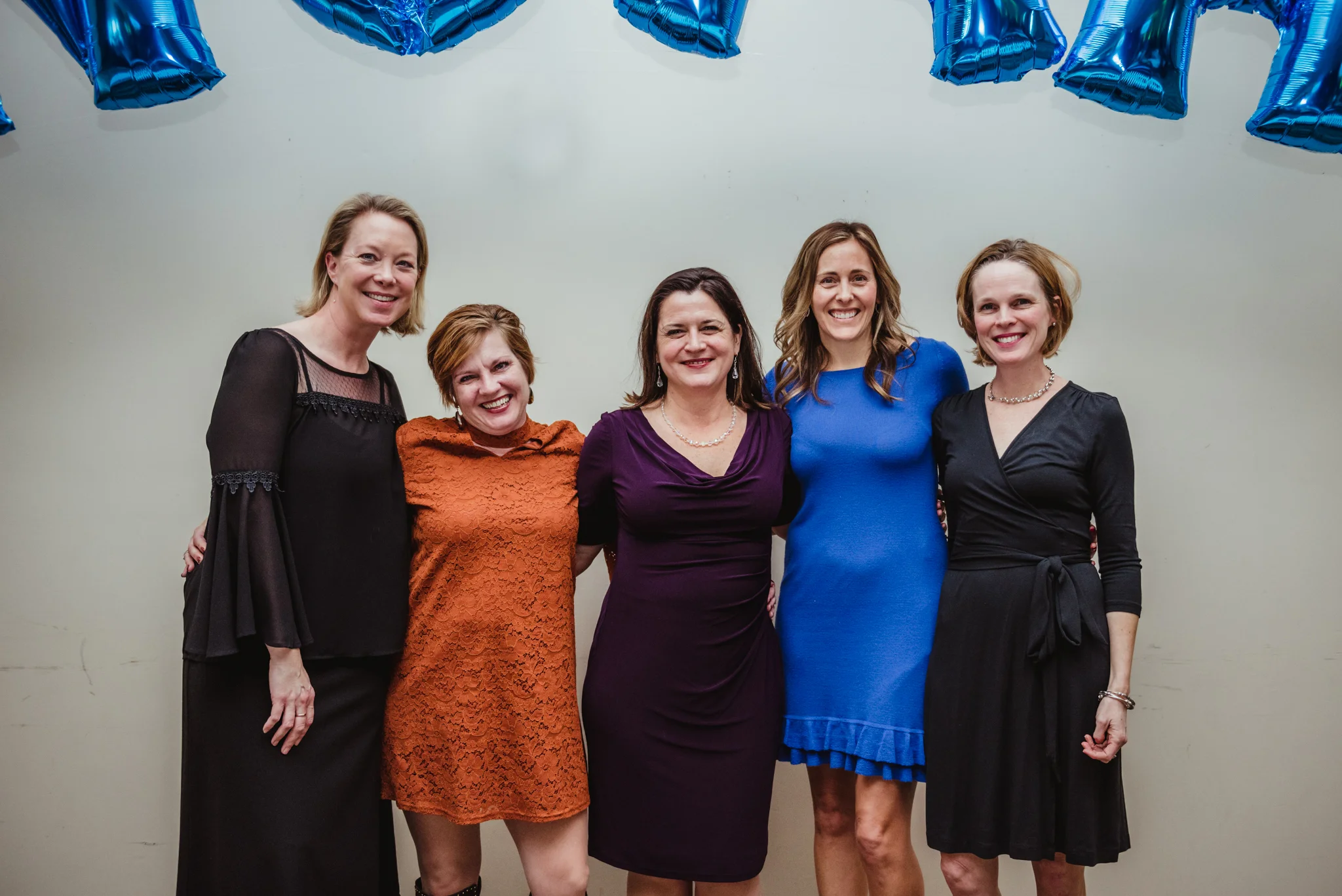 Friends pose for a group picture during the bar mitzvah reception at Temple Beth Or in Raleigh.