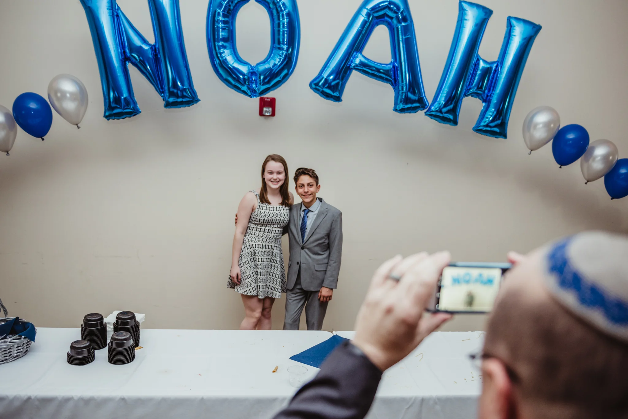 Noah poses with a friend during his bar mitzvah reception at Temple Beth Or in Raleigh.