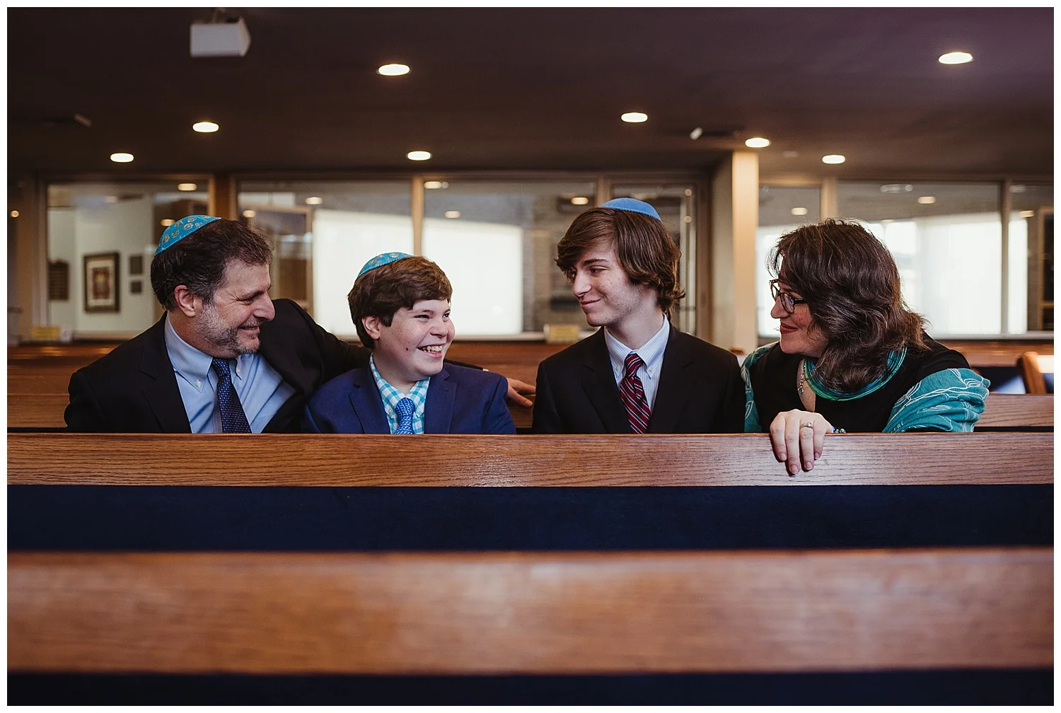 The family sits at the pew before their son becomes bar mitzvah at Temple Beth Or in Raleigh, NC. 