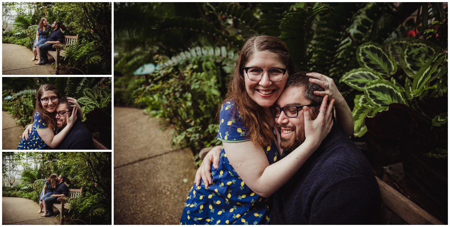 The couple share a quiet moment on a bench in the Butterfly House during their engagement photo session with Rose Trail Images in Durham, NC.