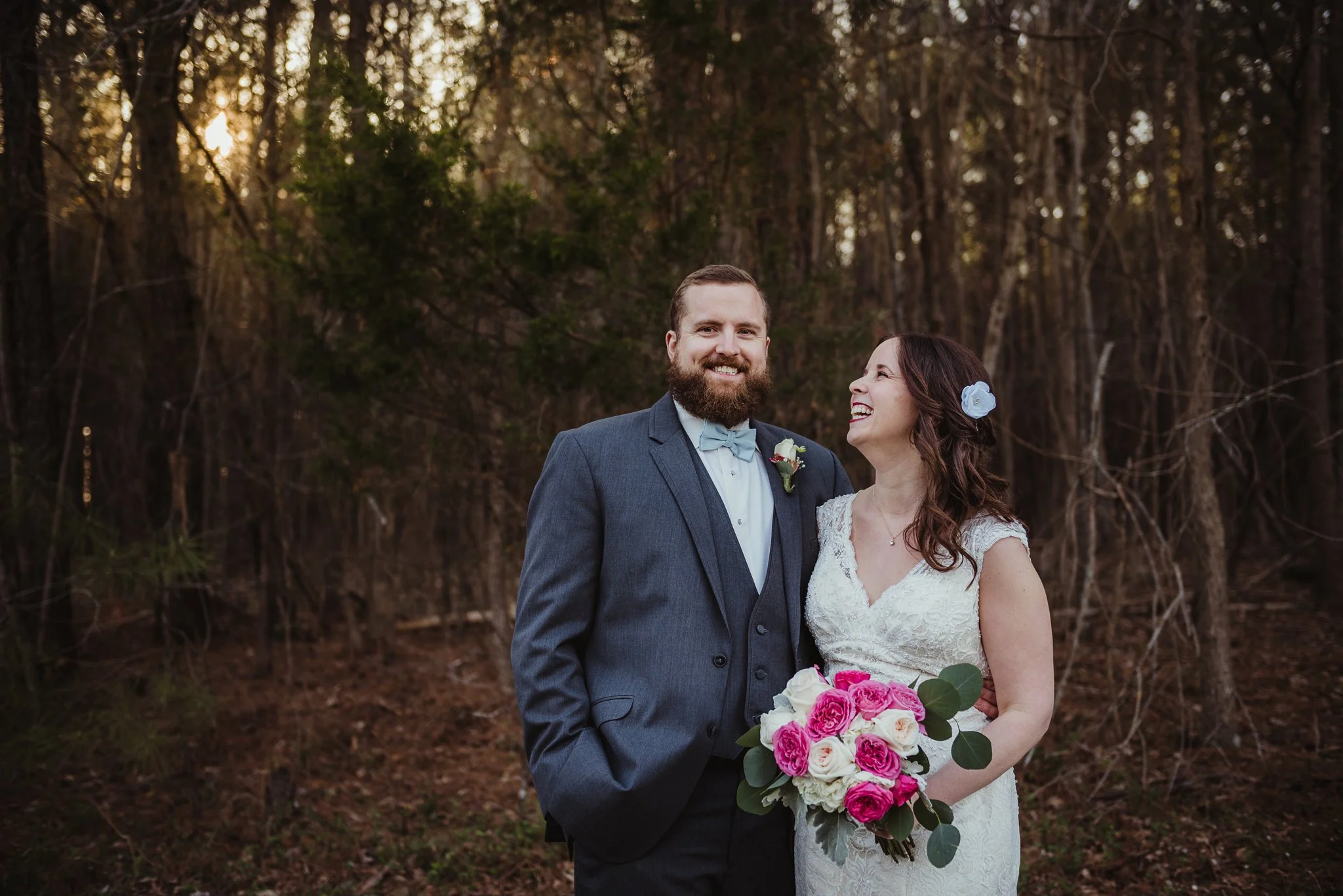 The bride and groom laughing together after the wedding ceremony with Rose Trail Images at Carlee Farms in Oxford, NC.