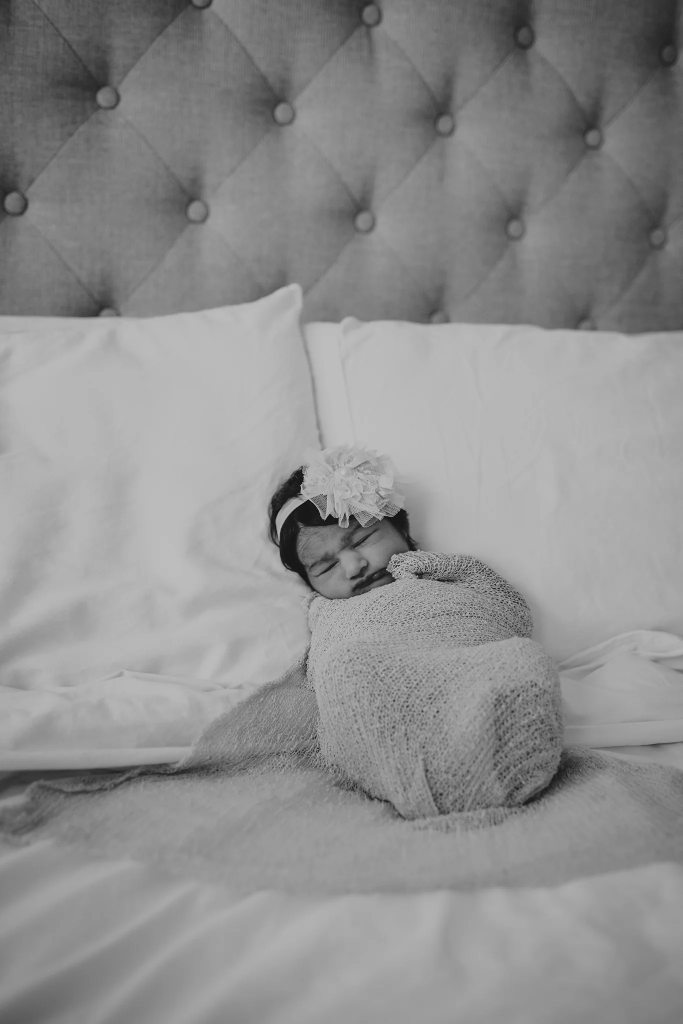 Baby girl Emma sleeps during her lifestyle newborn session with Rose Trail Images in Raleigh, North Carolina. 