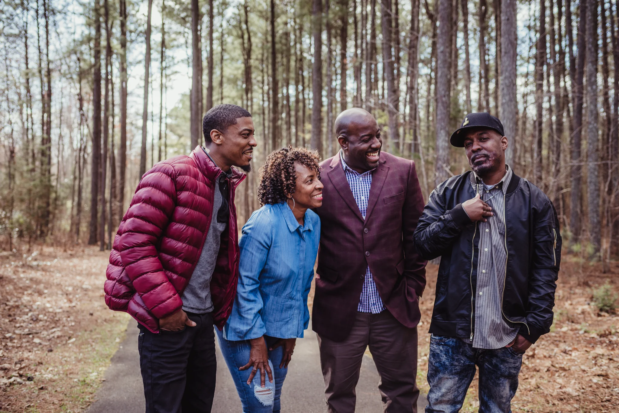 Mom and her three adult sons have a good time on the trail with Rose Trail Images in Rolesville Main Street Park.