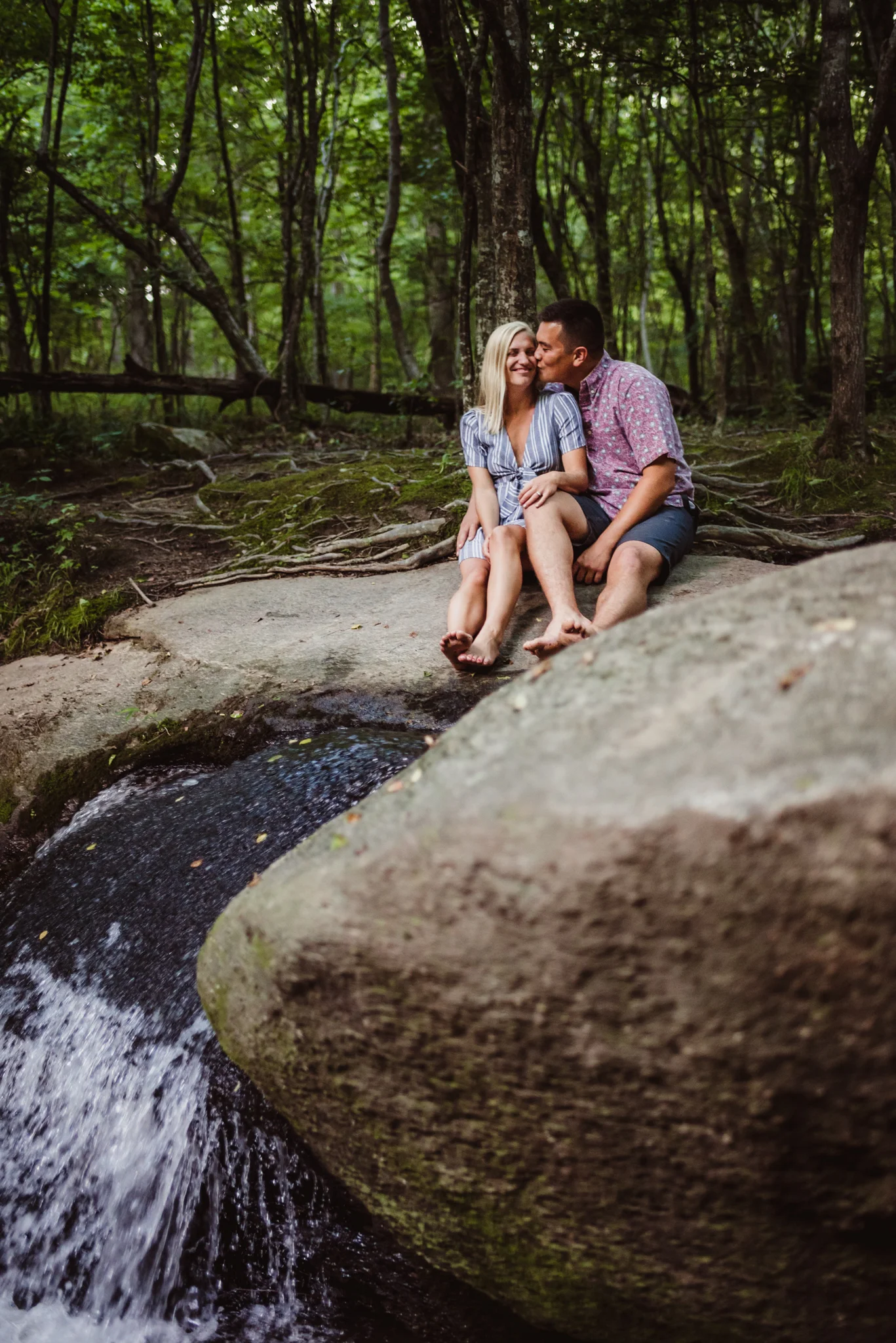 Kristin and Drew sat atop a waterfall for their engagement pictures in Raleigh with Rose Trail Images.