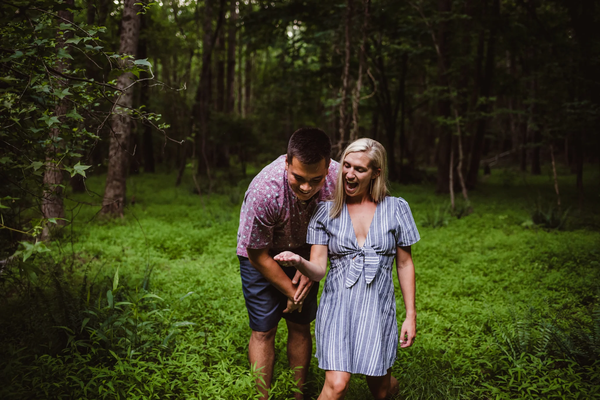 Kristin and Drew found a lightning bug in the woods during their engagement shoot in Raleigh with Rose Trail Images.