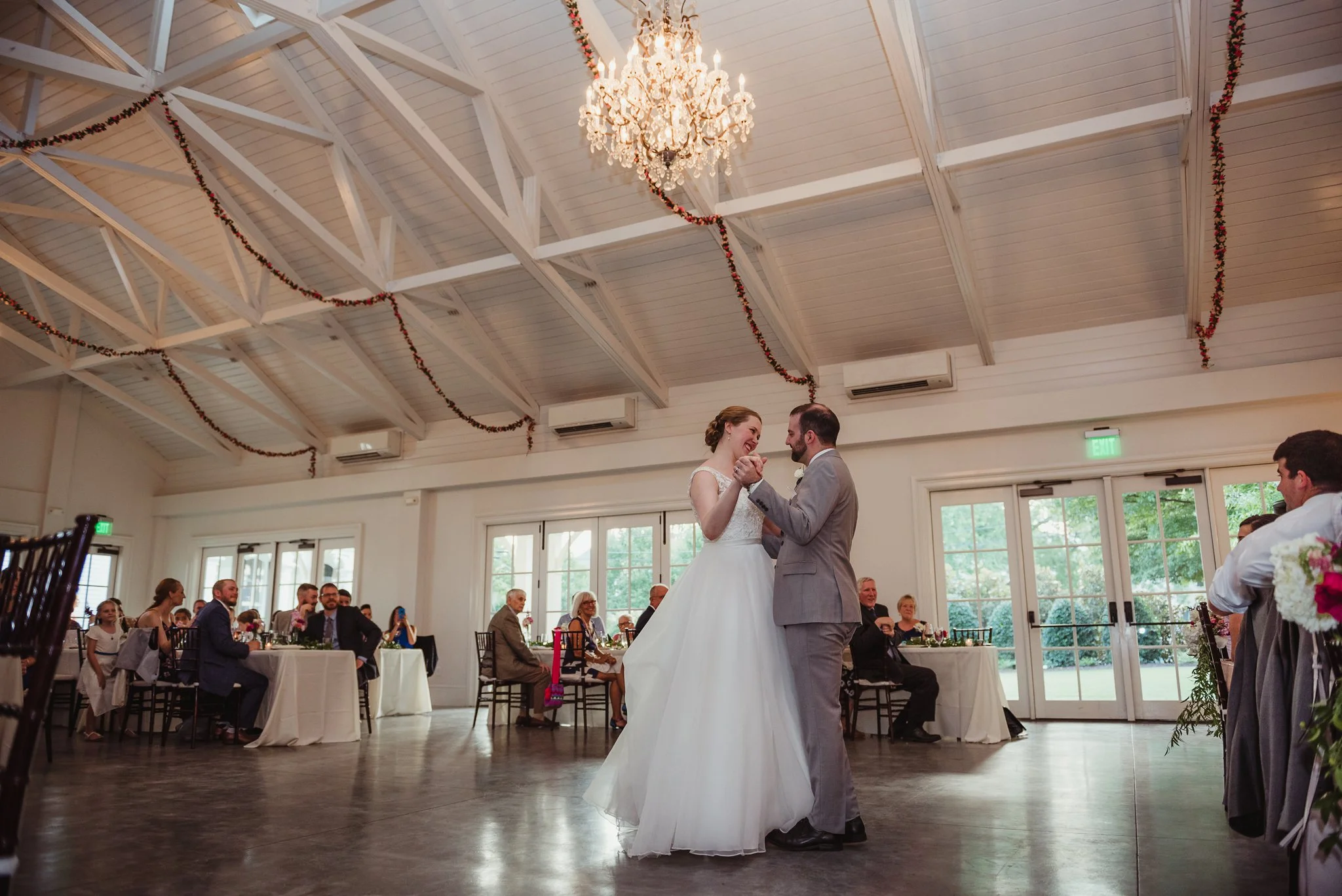 The bride and groom share a first dance during their wedding reception at the Merrimon Wynne in Raleigh, photos by Rose Trail Images.
