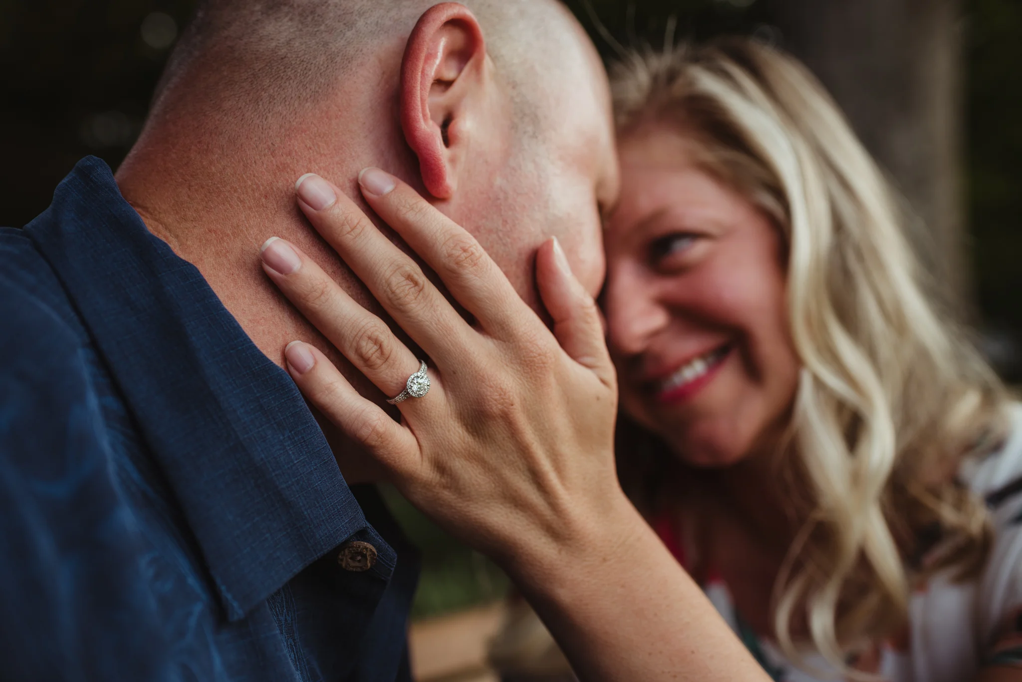 The couple look at each other closely during their engagement session with Rose Trail Images at Fred Fletcher Park in Raleigh, North Carolina.