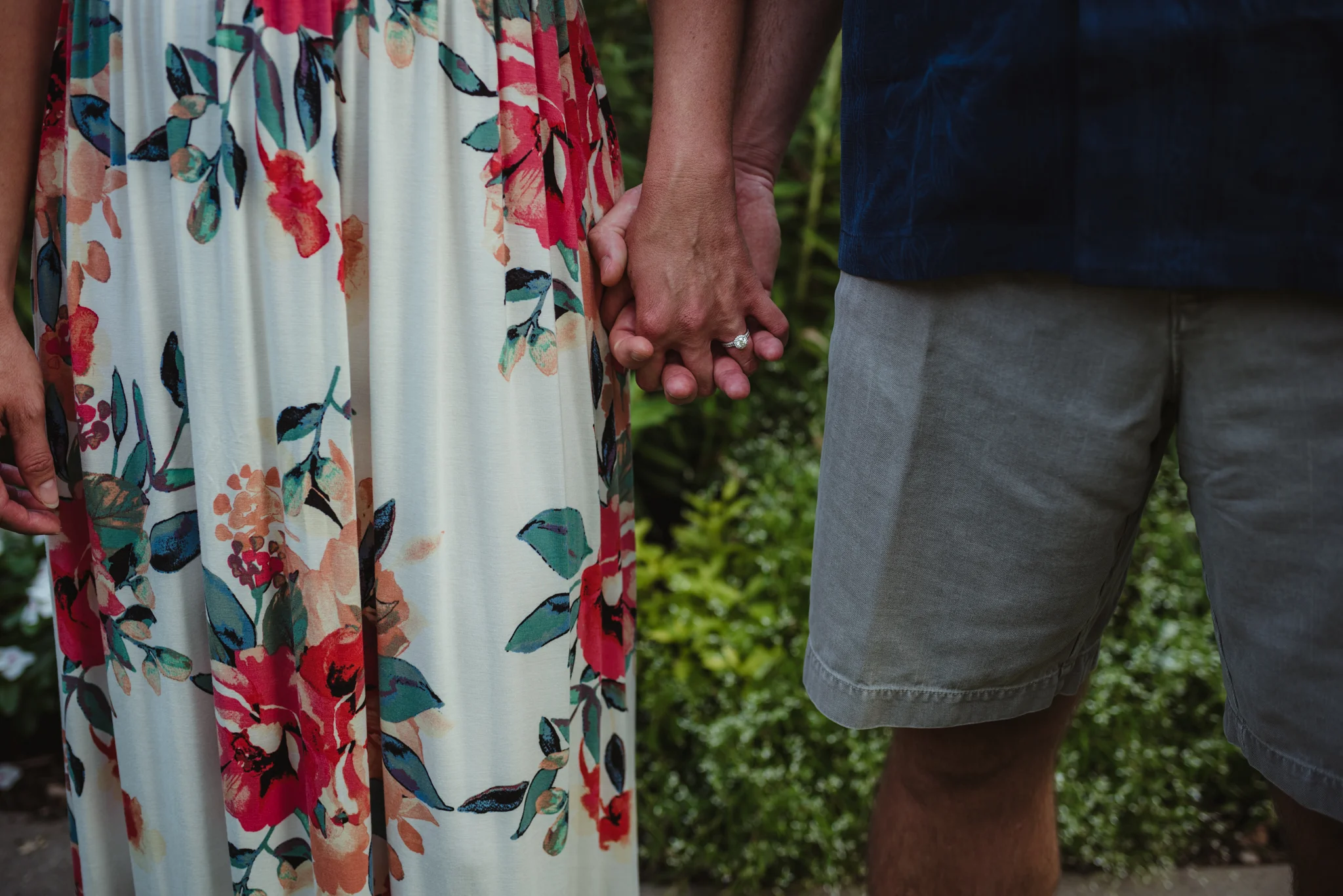 The bride and groom hold hands during their engagement session at Fred Fletcher Park in Raleigh, North Carolina with Rose Trail Images.