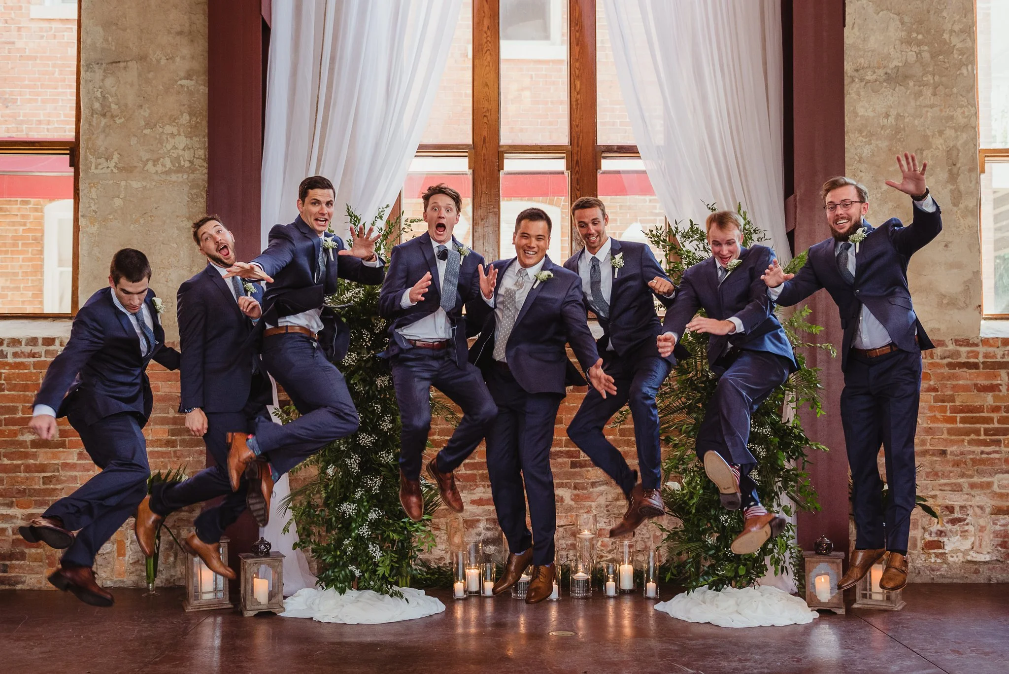 The groomsmen and the groom jump for joy before his wedding in Wilmington, NC, photo by Rose Trail Images.