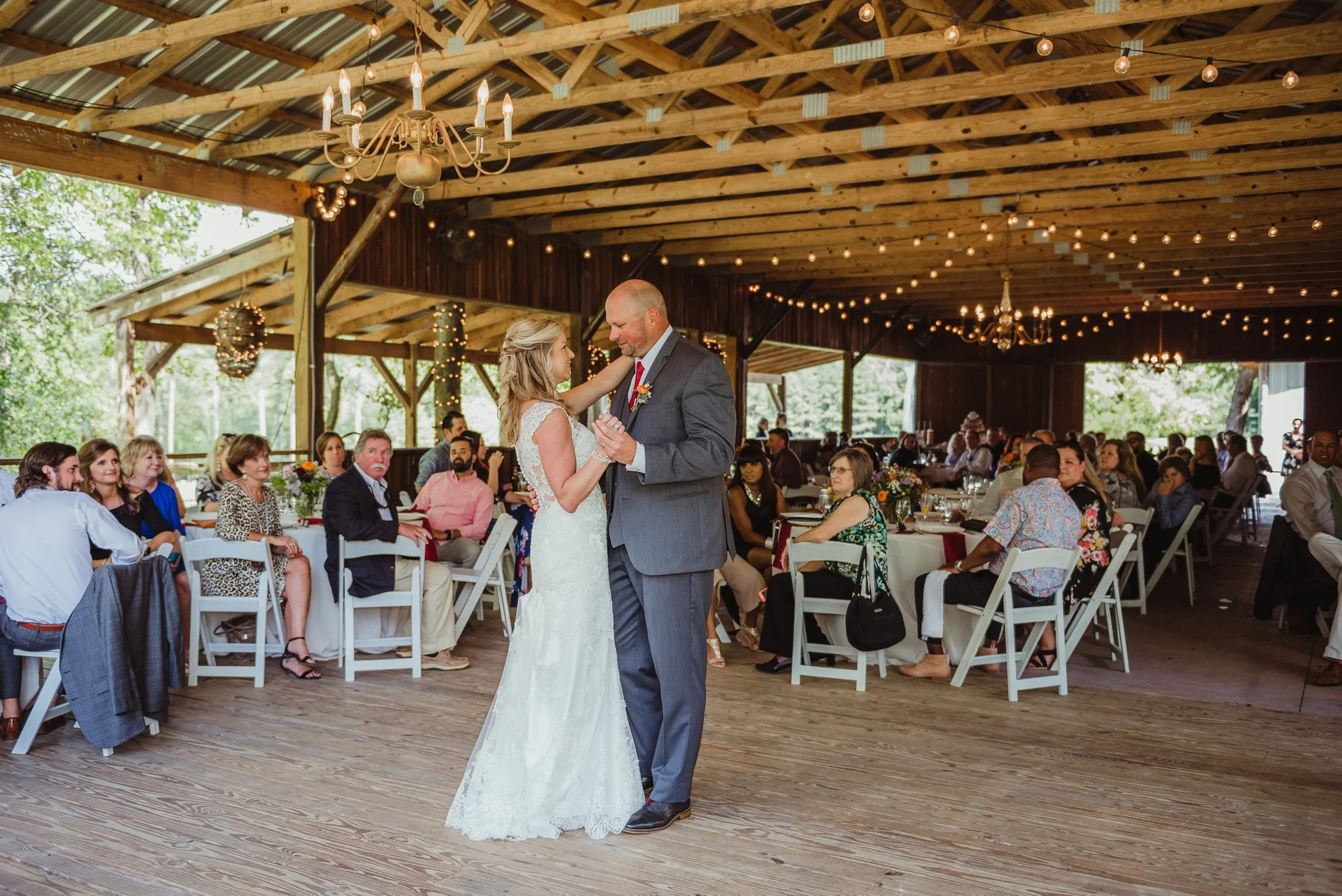 The bride and groom share their first dance during their wedding reception at Cedar Grove Acres near Raleigh, pictures by Rose Trail Images.