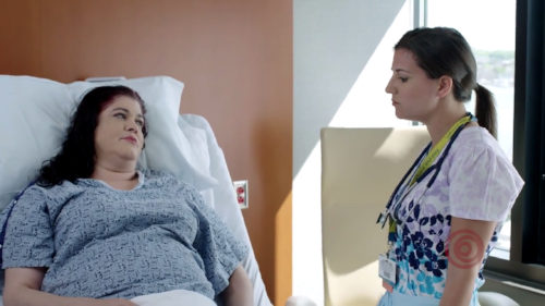 Nurse and patient discussing treatment. 